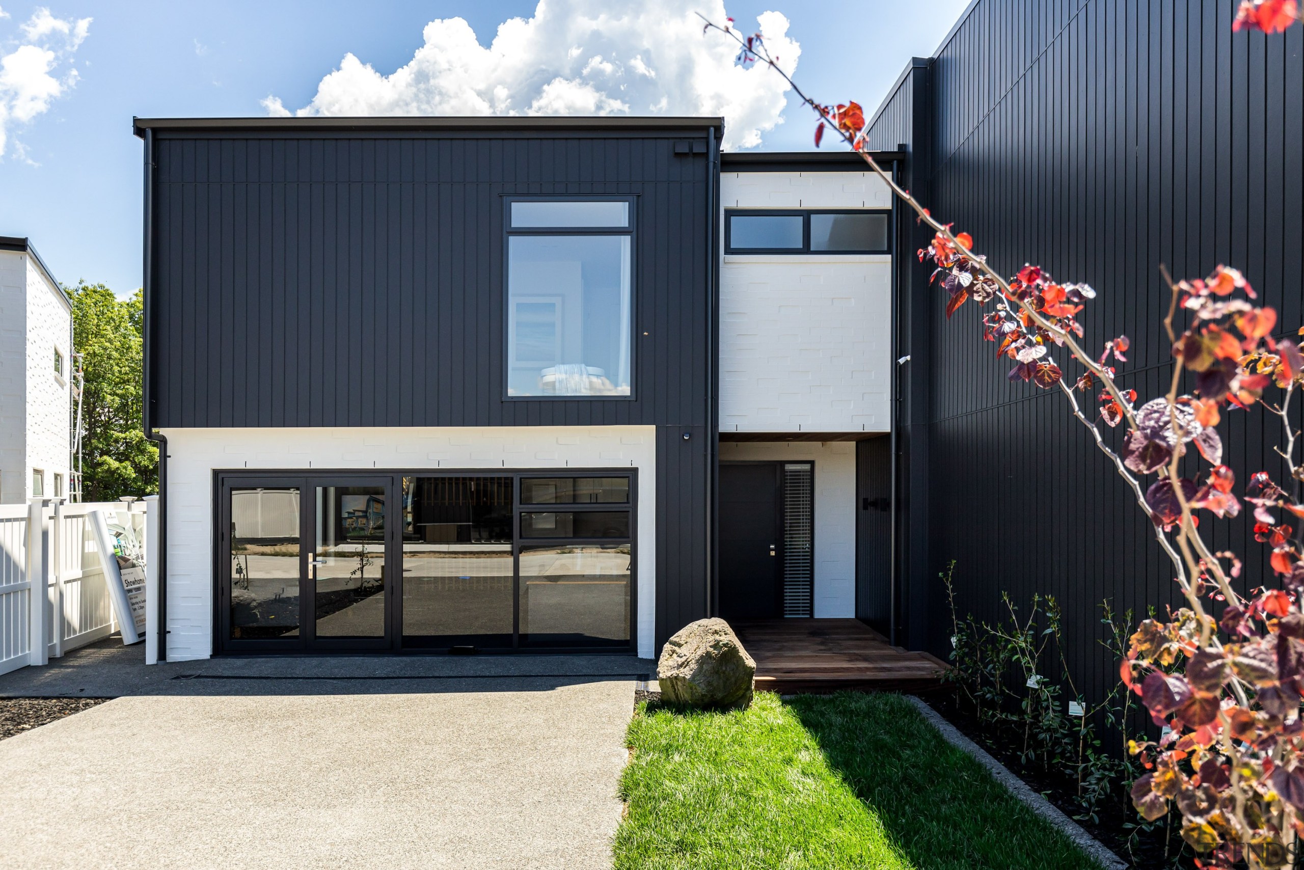 The showhome’s exterior of bold black vertical cladding 