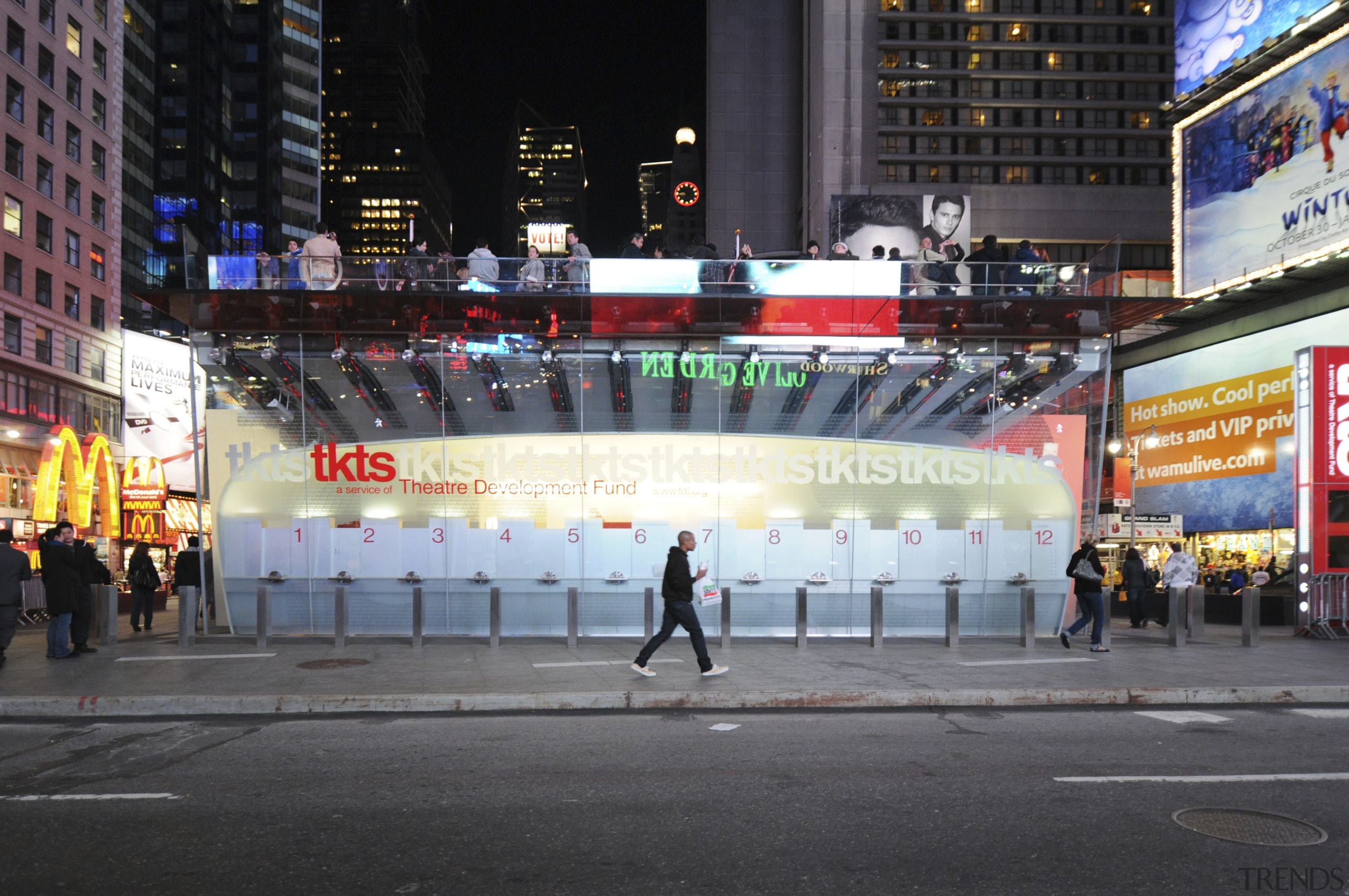 View of the new TKTS ticketing booth in advertising, building, city, crowd, downtown, infrastructure, landmark, metropolis, metropolitan area, night, pedestrian, pedestrian crossing, street, urban area, black