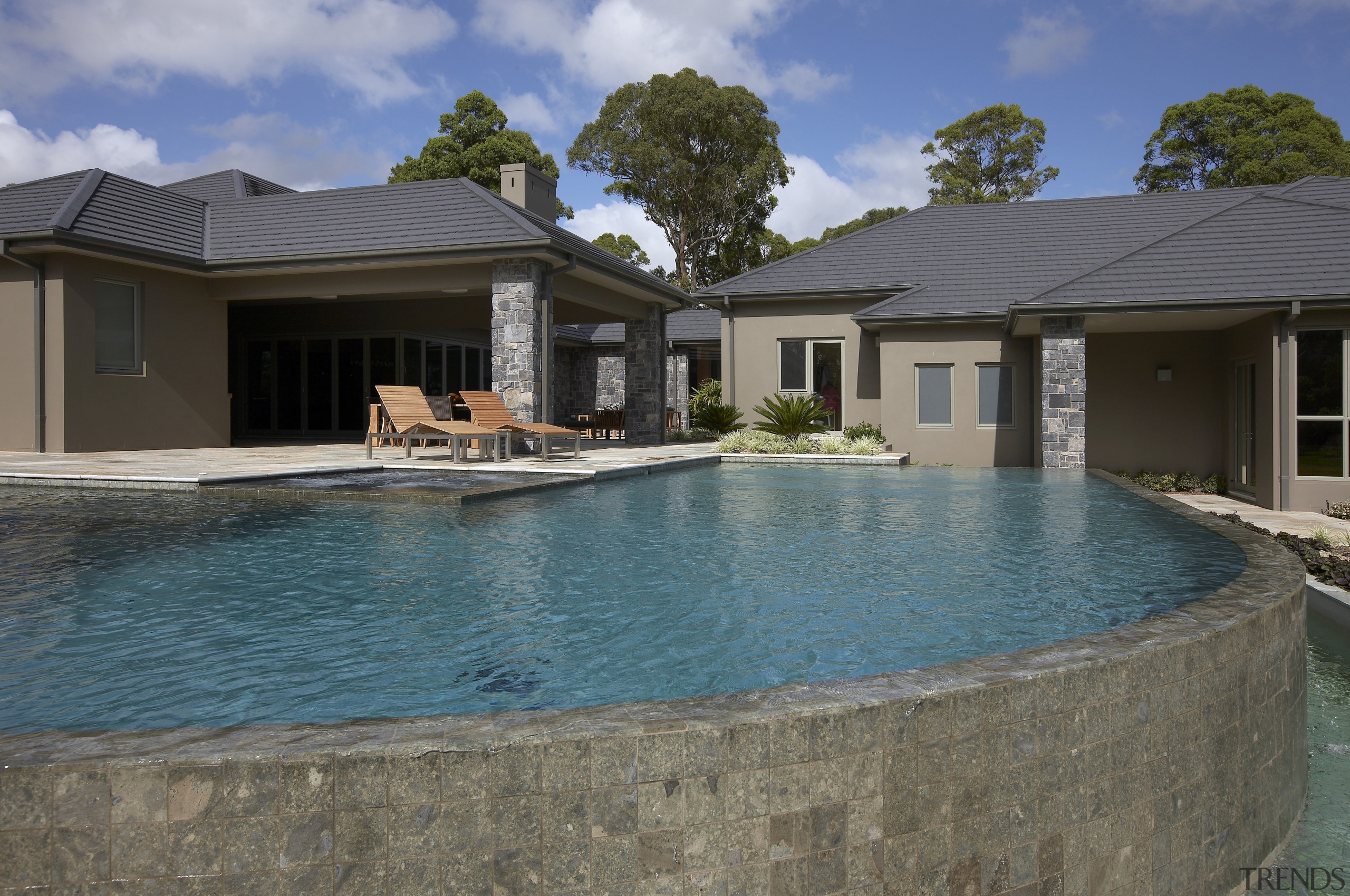 Exterior view of new home which features a backyard, cottage, estate, home, house, leisure, property, real estate, reflection, residential area, resort, swimming pool, villa, water, gray