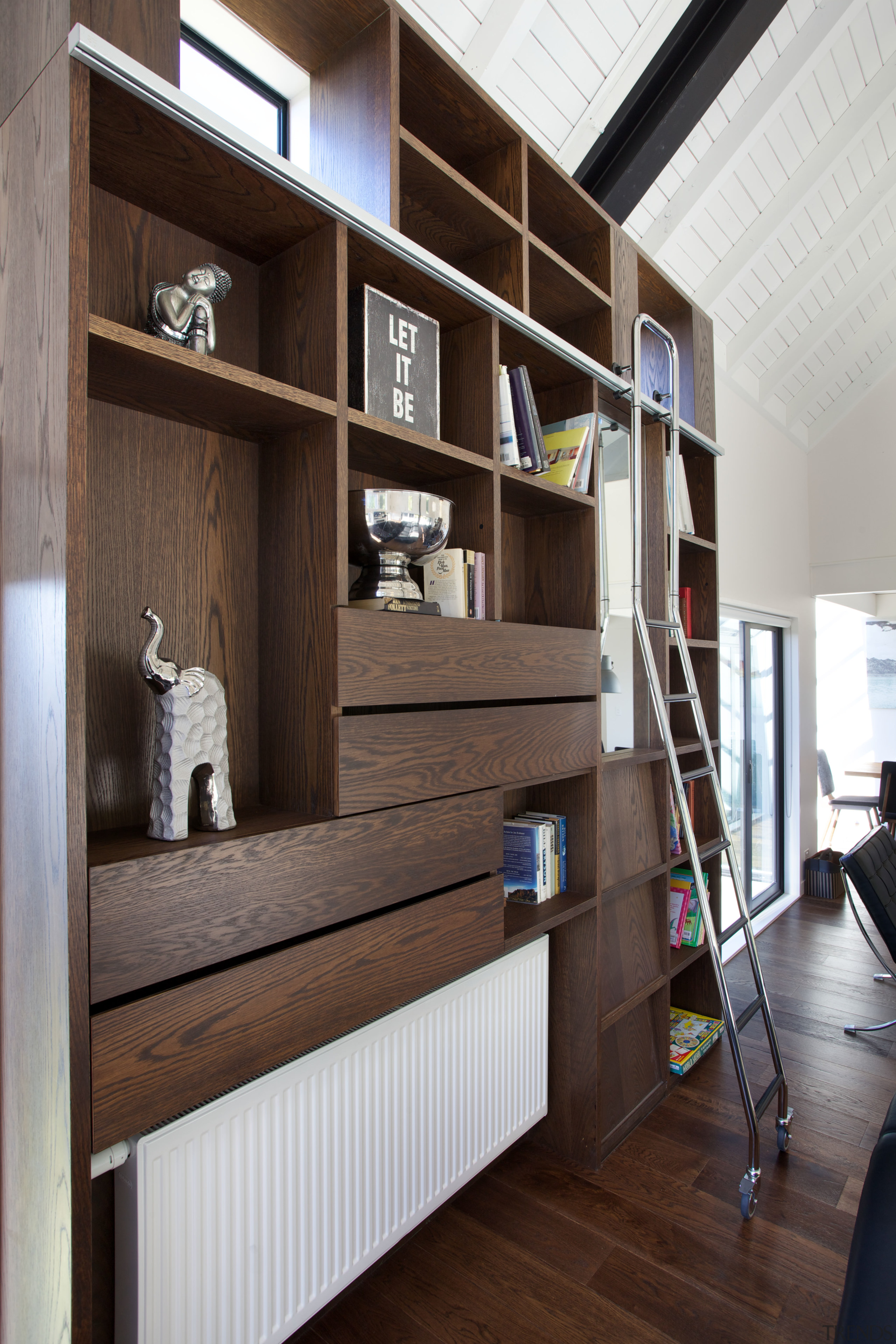 Niches and shelves create a sculptural and functional bookcase, furniture, interior design, shelf, shelving, black, gray