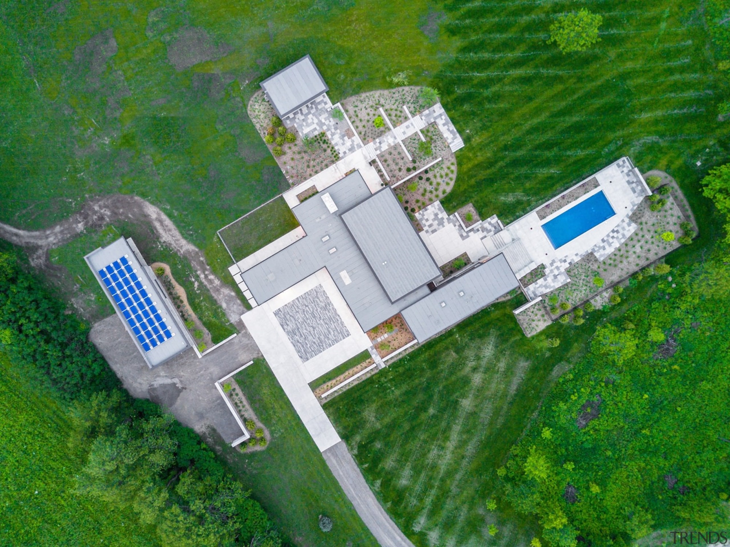 A drone view of the home, with garage aerial photography, bird's eye view, land lot, urban design, green