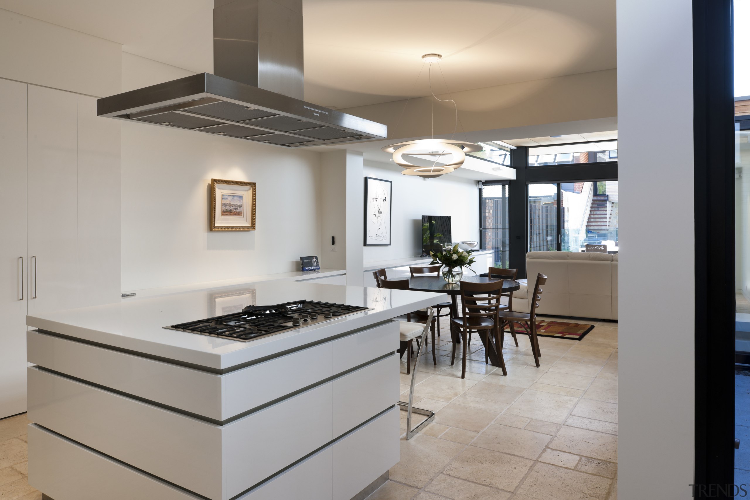 Kitchen with white island and stainless range. - countertop, interior design, kitchen, real estate, room, gray