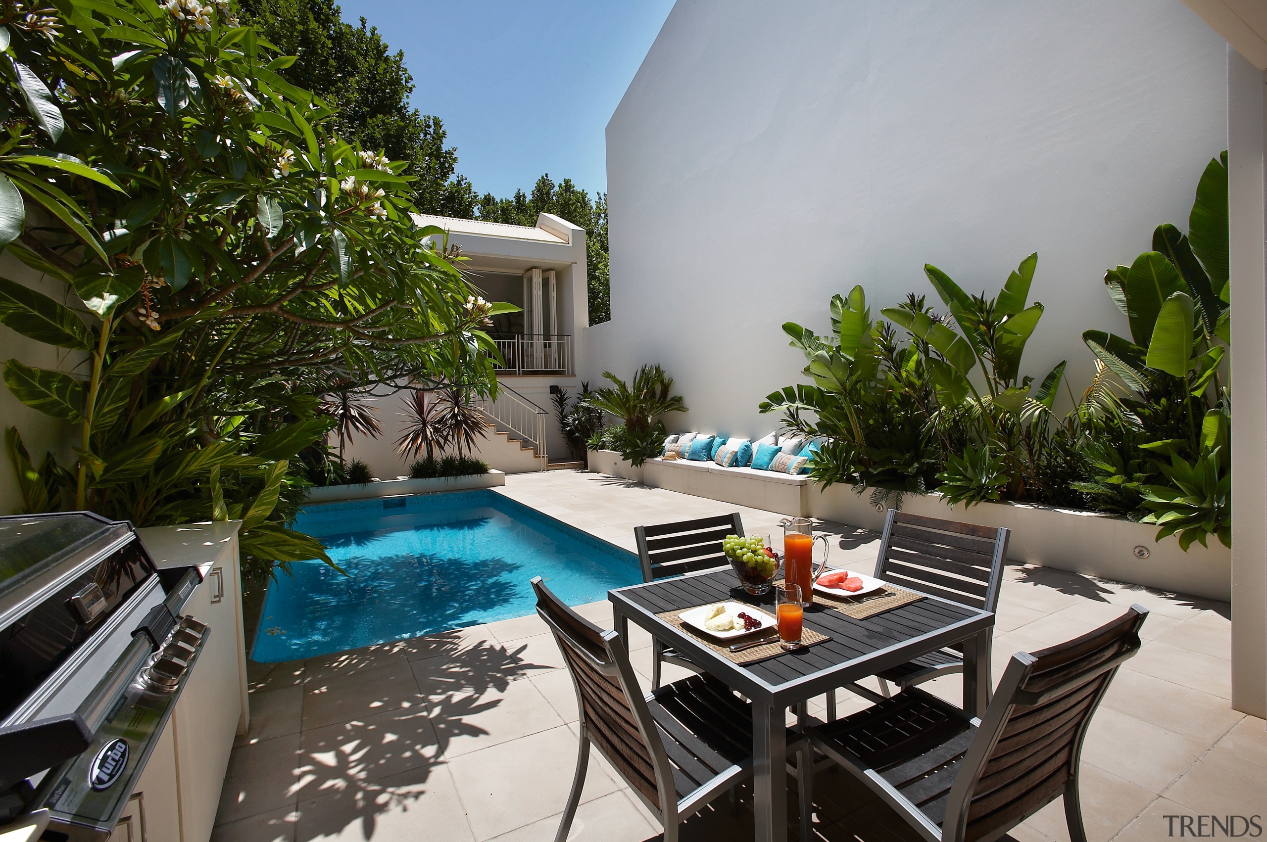 View of this Secluded pool surround by lush backyard, estate, home, house, leisure, property, real estate, resort, swimming pool, vacation, villa, gray, brown