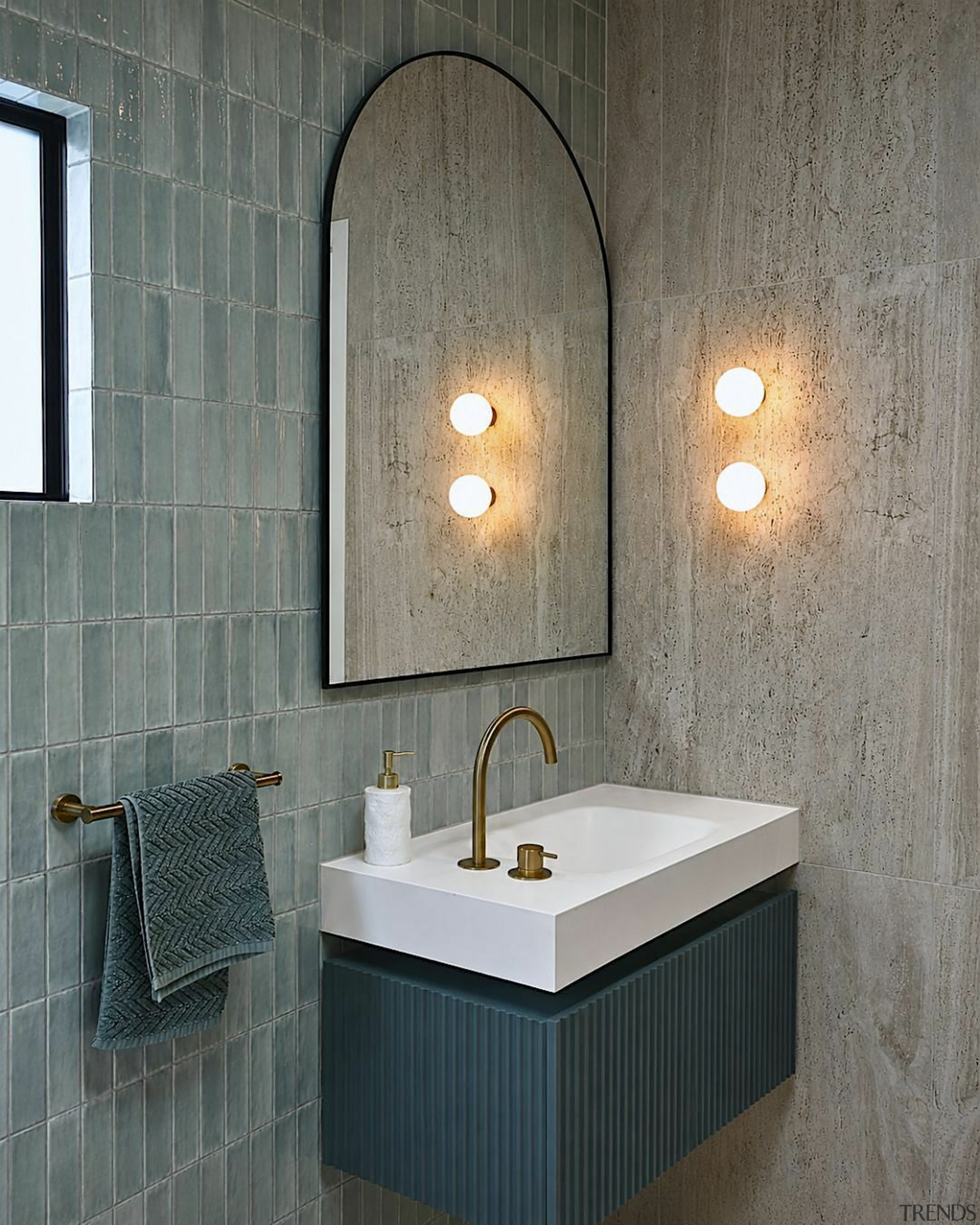 The custom ribbed vanity brings depth and texture, 