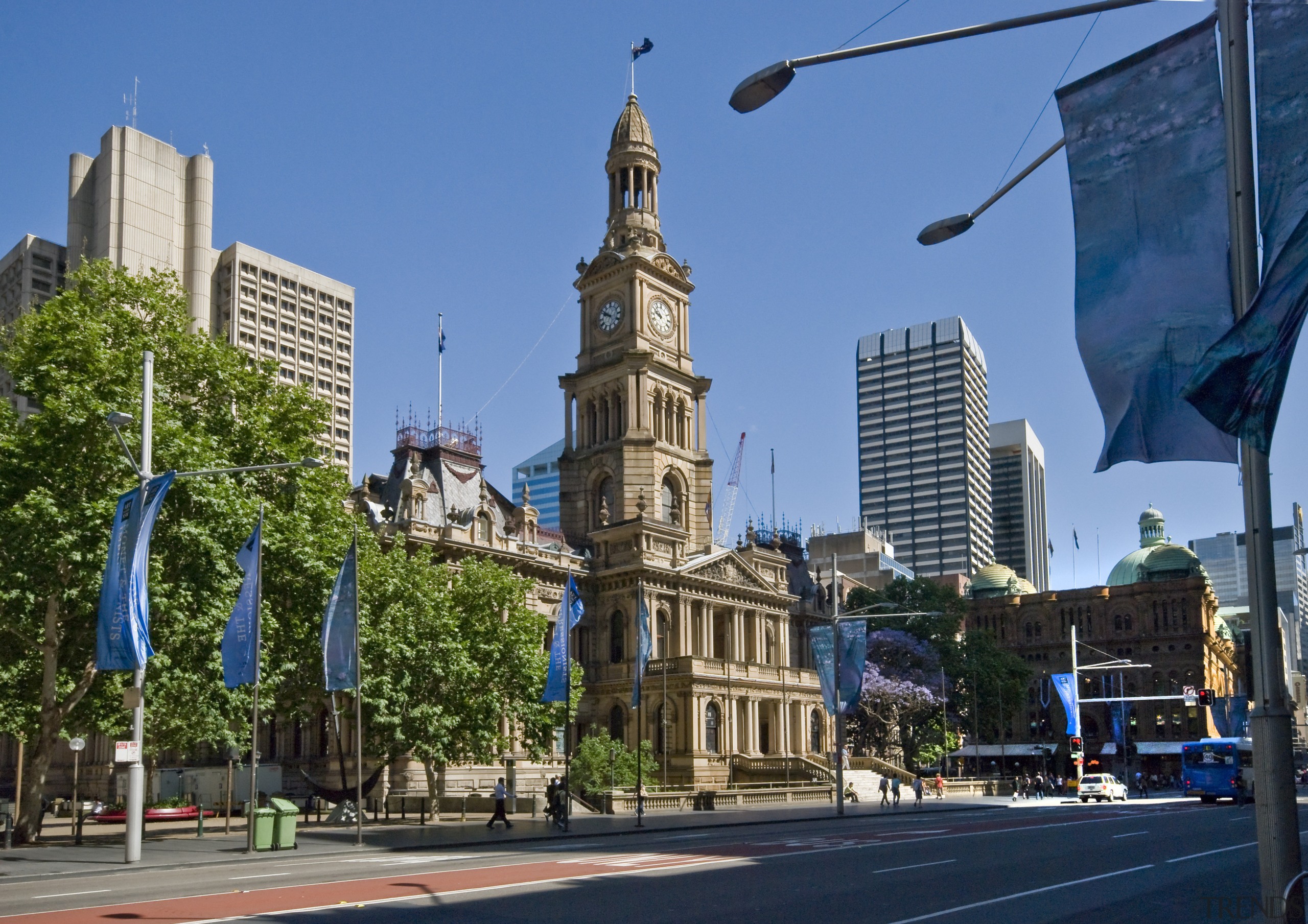 View of the renovated Sydney town hall featuring building, city, daytime, downtown, landmark, metropolis, metropolitan area, neighbourhood, plaza, sky, skyline, skyscraper, street, tourist attraction, town, urban area, teal