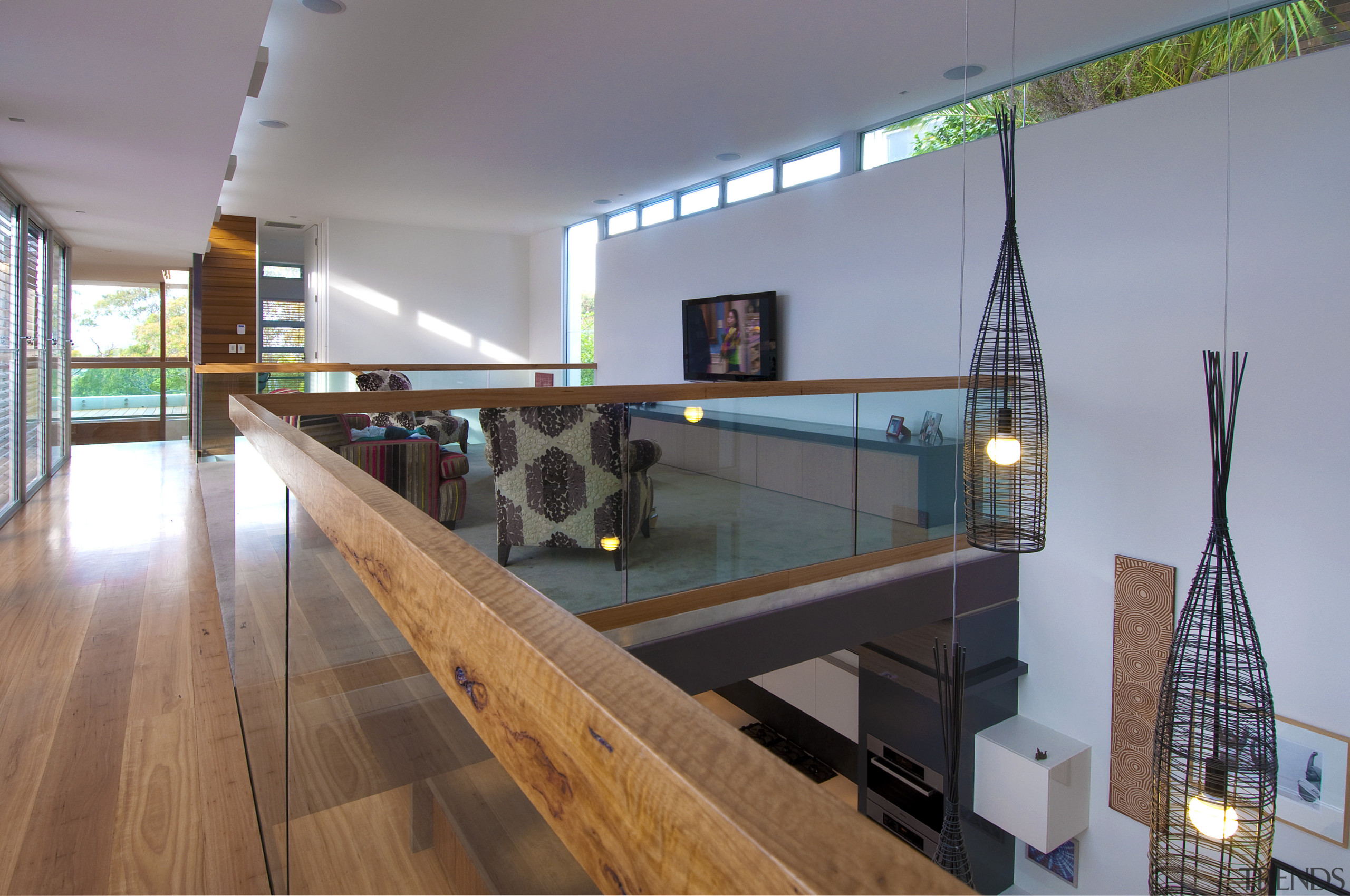 View of mezzanine area with wooden floor and glass, handrail, interior design, gray