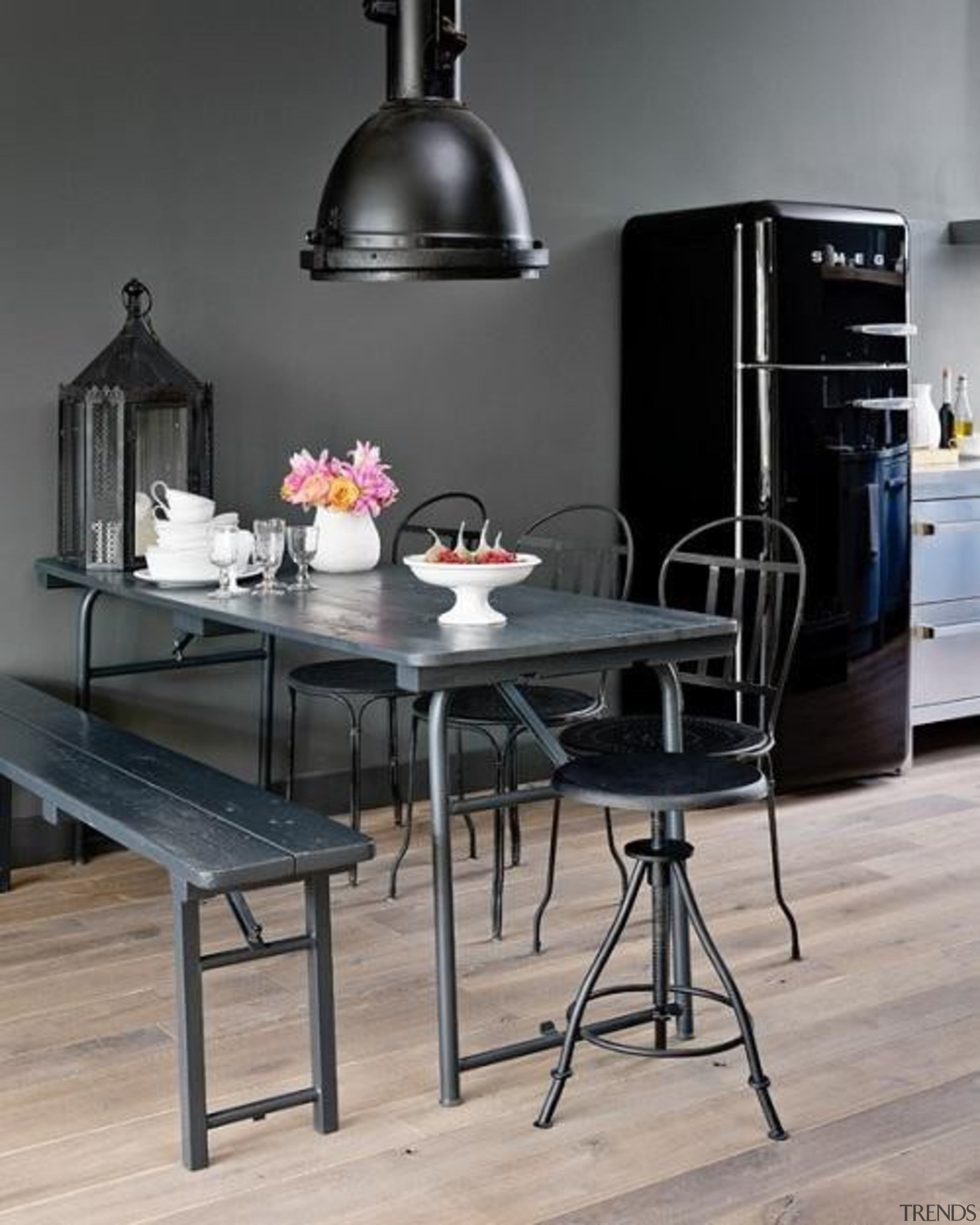 Industrial style kitchen featuring Smeg appliances. Black army chair, dining room, furniture, interior design, product design, table, gray, black