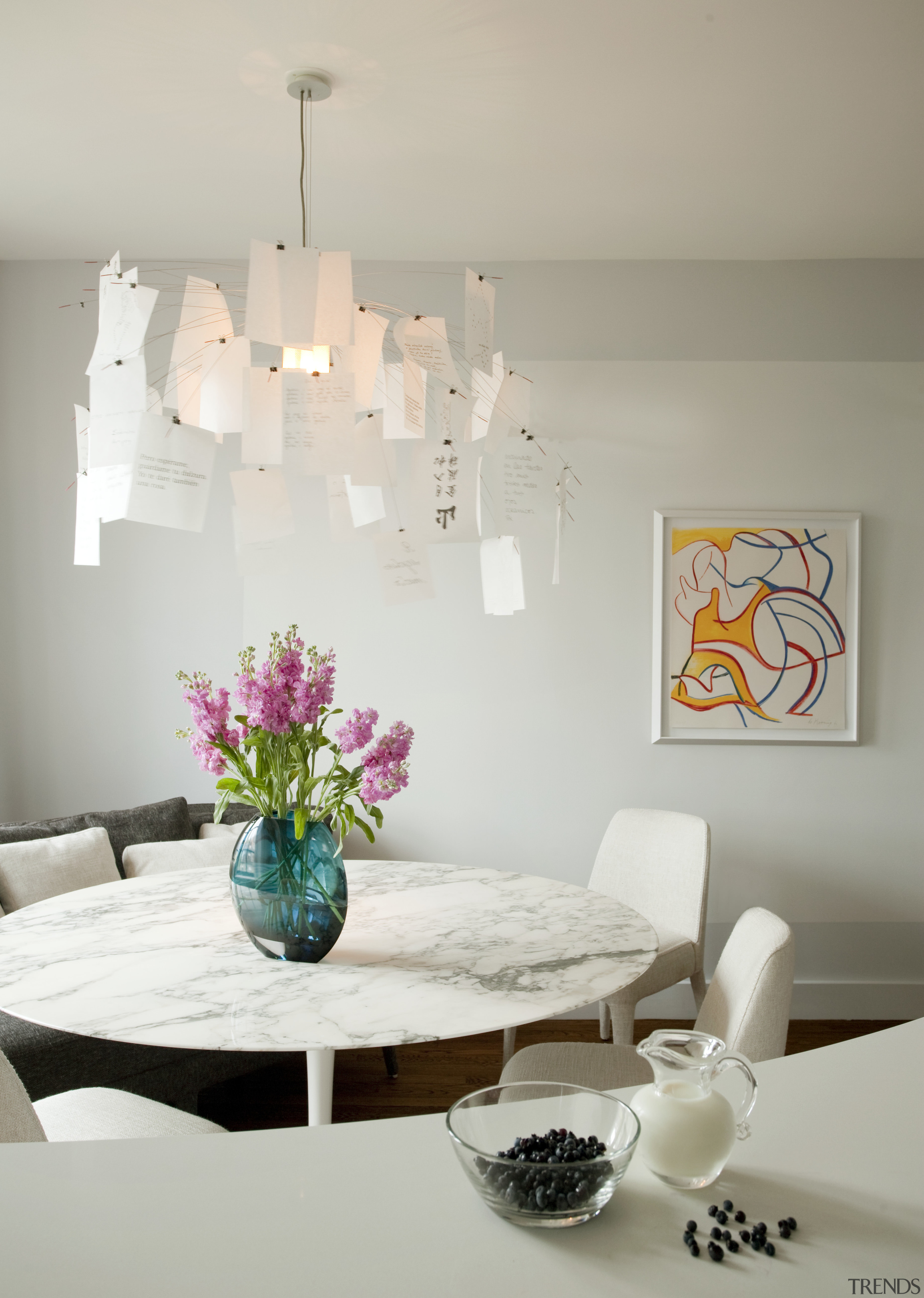 Dining area in white interior with spring colors ceiling, chandelier, dining room, furniture, home, interior design, lampshade, light fixture, lighting, lighting accessory, living room, product design, room, table, wall, gray