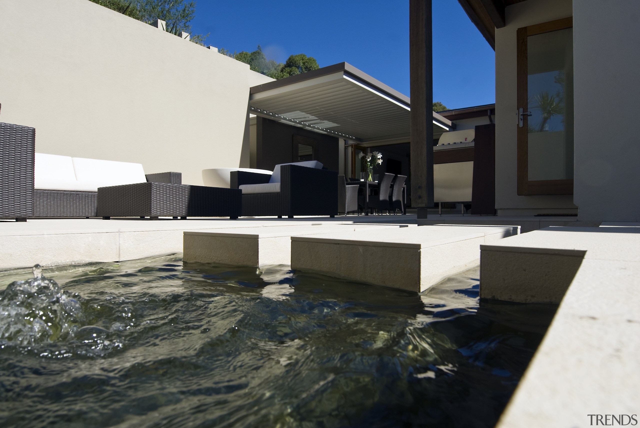 View of pool and spa area with wooden architecture, house, black, white
