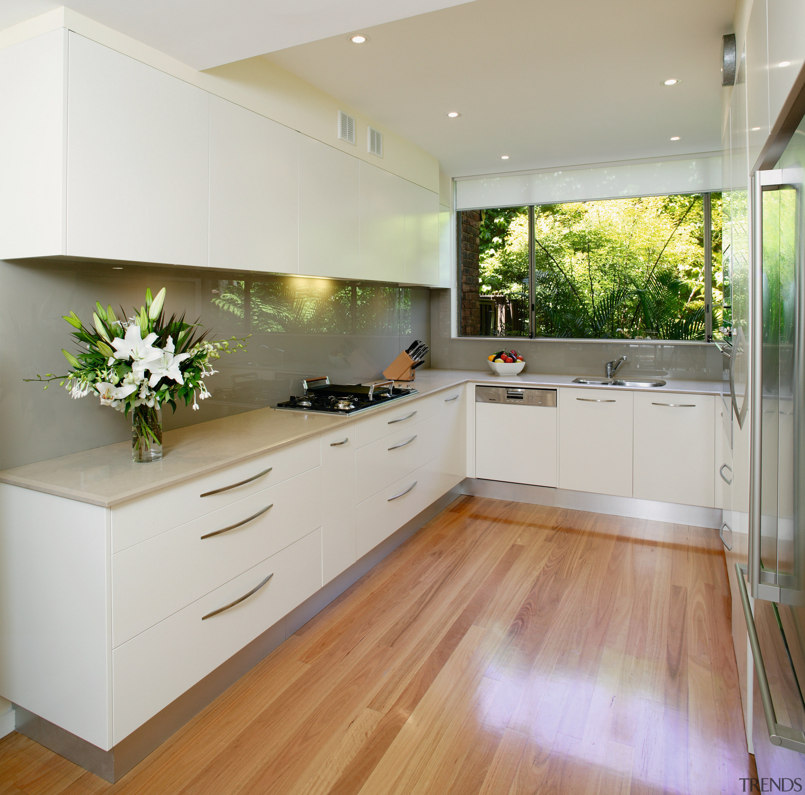 Kitchen with white cabinetry, grey benchtops and splashback, cabinetry, countertop, cuisine classique, floor, flooring, hardwood, interior design, kitchen, laminate flooring, real estate, room, wood flooring, gray