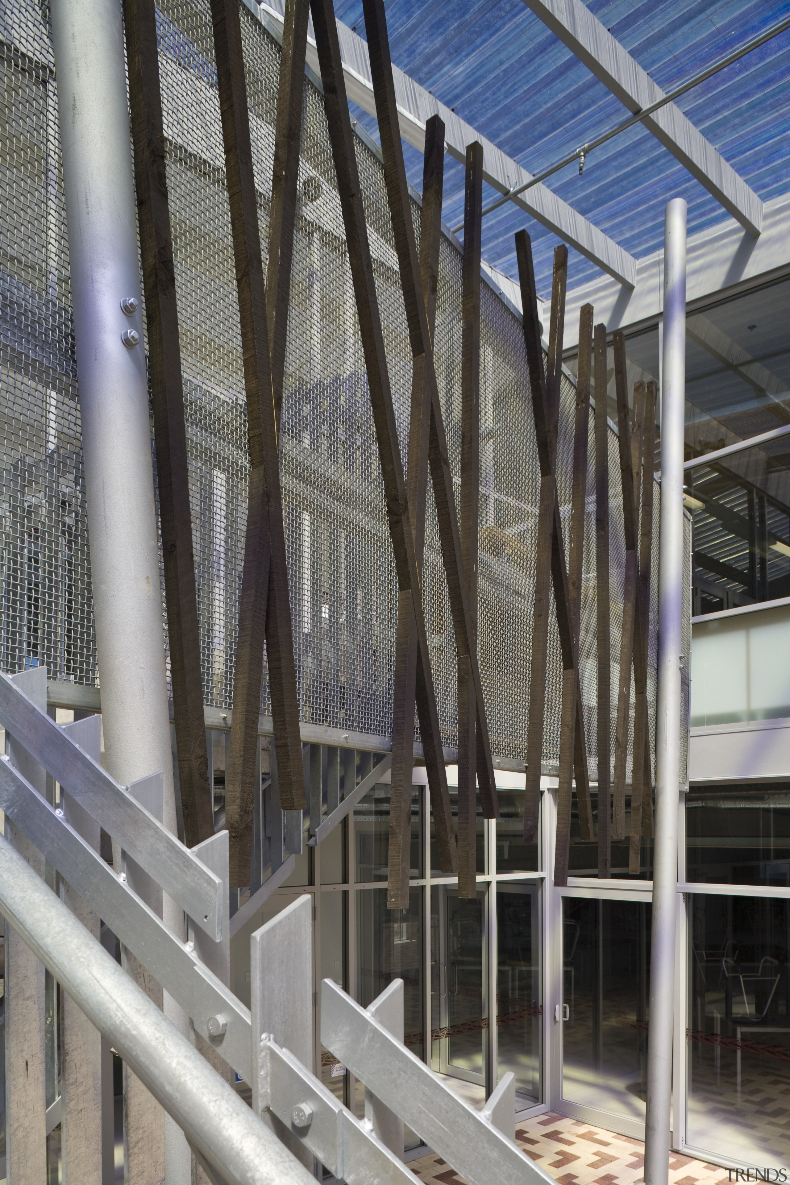 Exterior view of school with stairways which feature building, daylighting, facade, handrail, steel, structure, gray, black