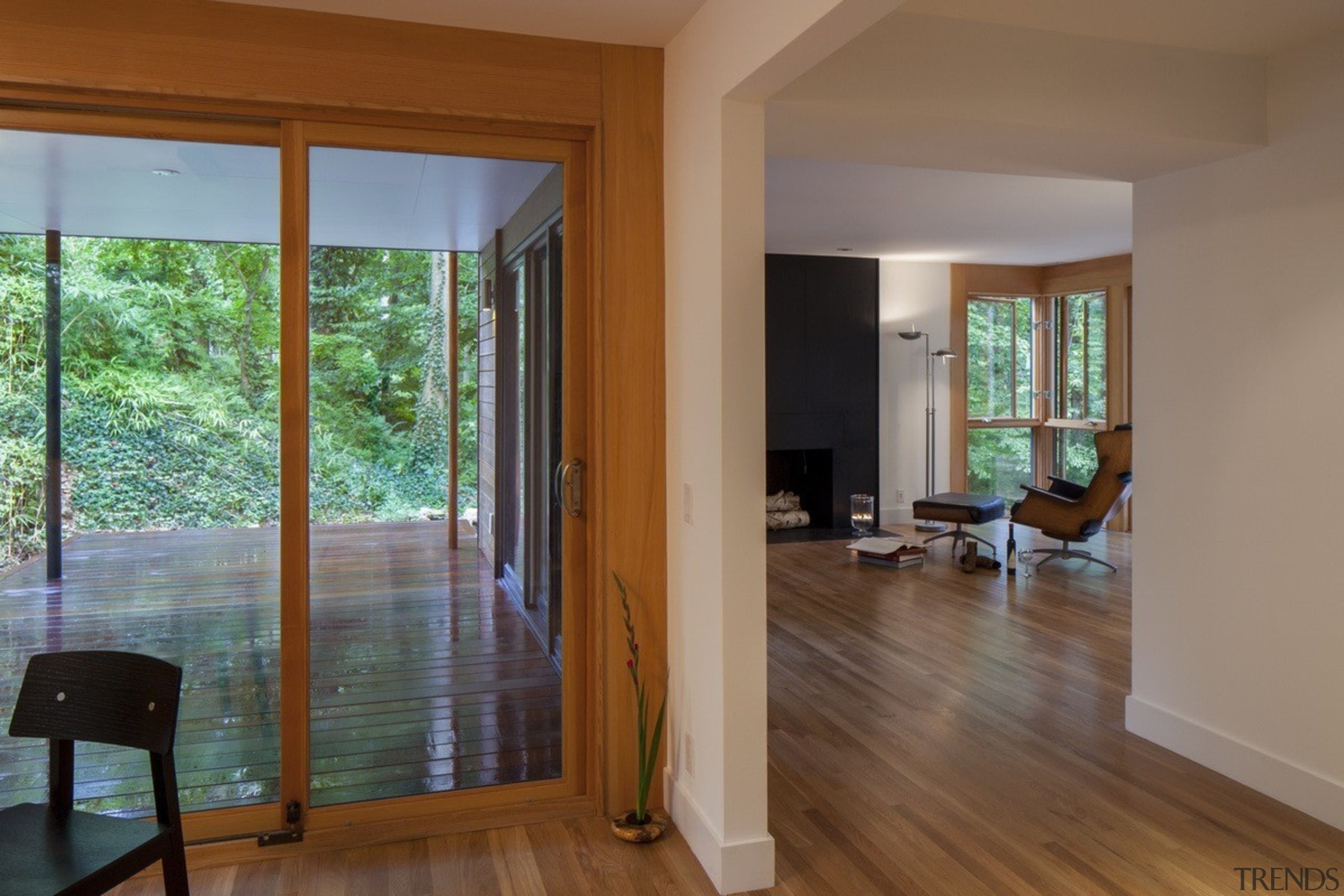 A view down into the lounge - A door, estate, floor, flooring, hardwood, home, house, interior design, laminate flooring, living room, property, real estate, room, window, wood, wood flooring, brown, gray