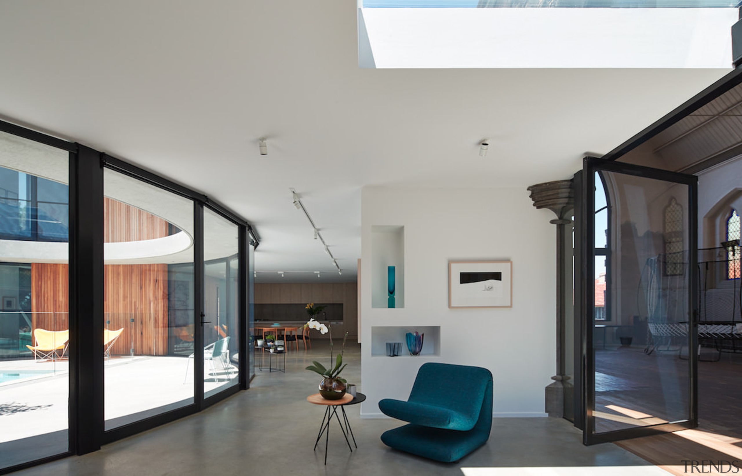 A large skylight sits above this room - architecture, ceiling, daylighting, door, glass, house, interior design, living room, property, real estate, window, gray