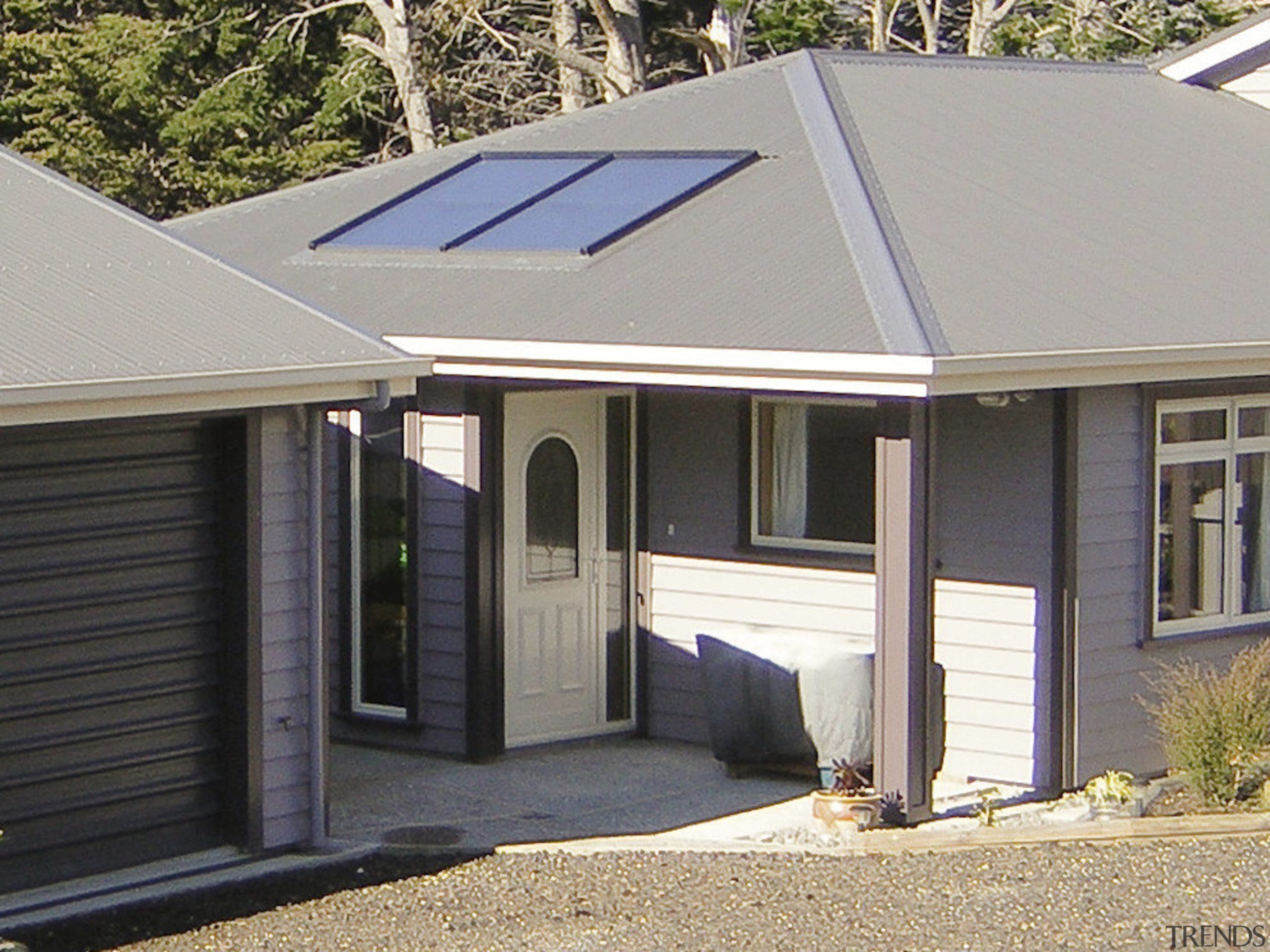 This large home efficiently uses solar energy thanks home, house, property, real estate, roof, siding, window, gray, black