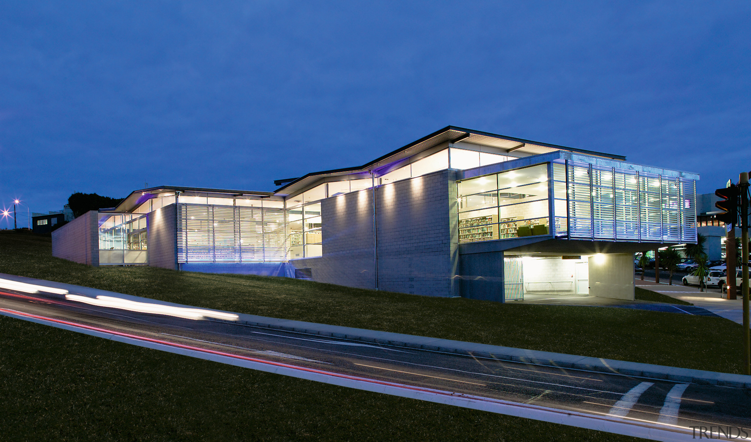 view of the whangaporoa public library - view architecture, building, commercial building, corporate headquarters, facade, home, house, metropolitan area, mixed use, night, real estate, reflection, residential area, sky, structure, blue, black