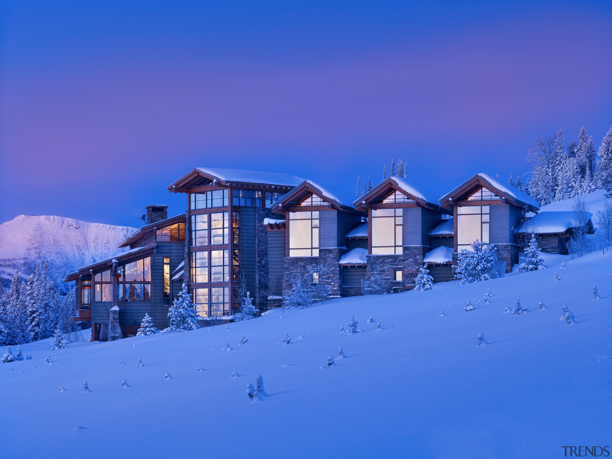 Gabled roofs and weatherboards abound in this Montana alps, arctic, atmosphere, blue, building, cloud, evening, freezing, home, house, light, log cabin, morning, mountain, mountain range, real estate, sky, snow, winter, blue