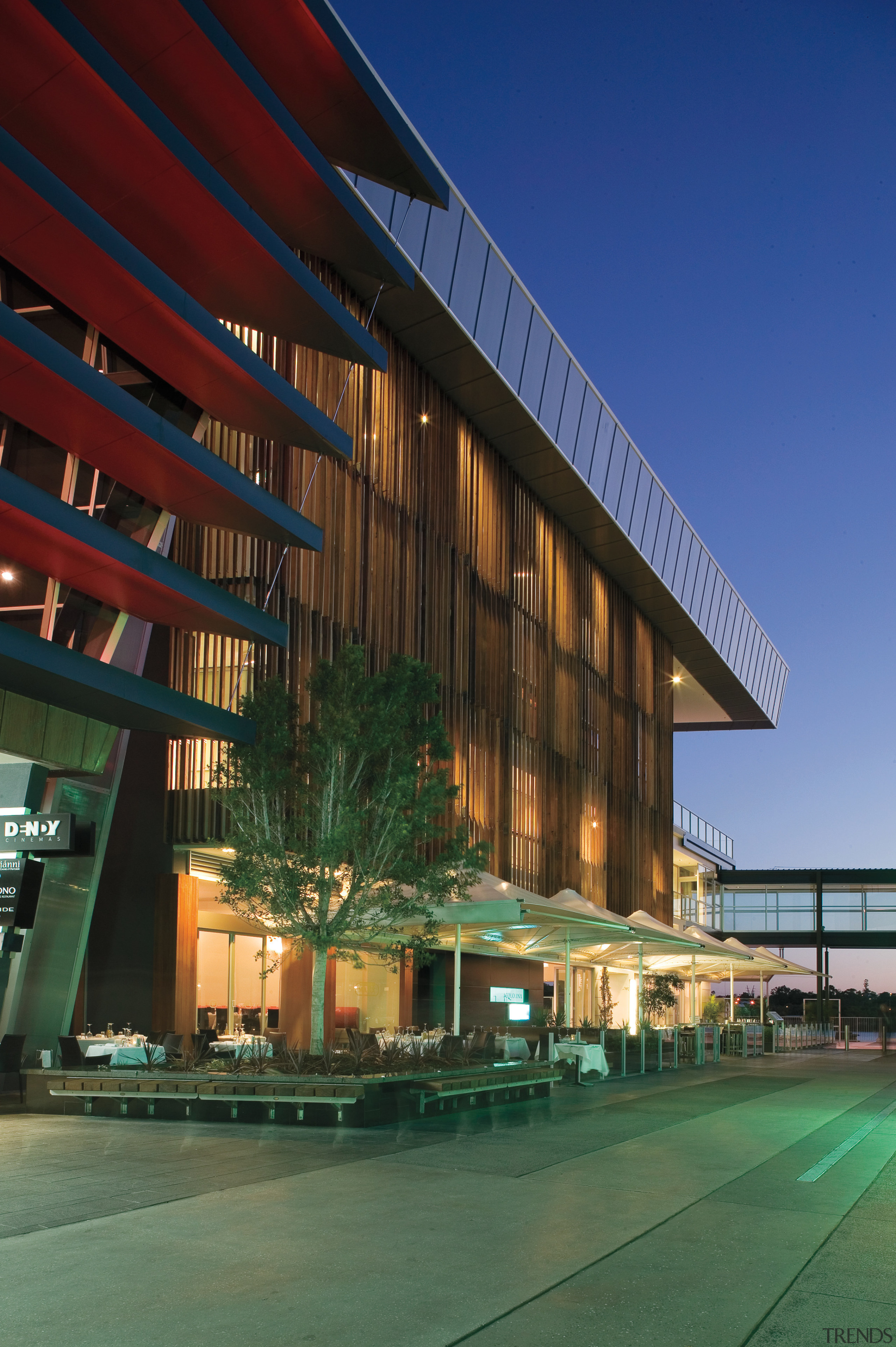 An exterior view of the Restaurants &amp; shops architecture, building, commercial building, condominium, convention center, corporate headquarters, facade, headquarters, hotel, metropolitan area, mixed use, real estate, reflection, residential area, sky, structure, blue, green