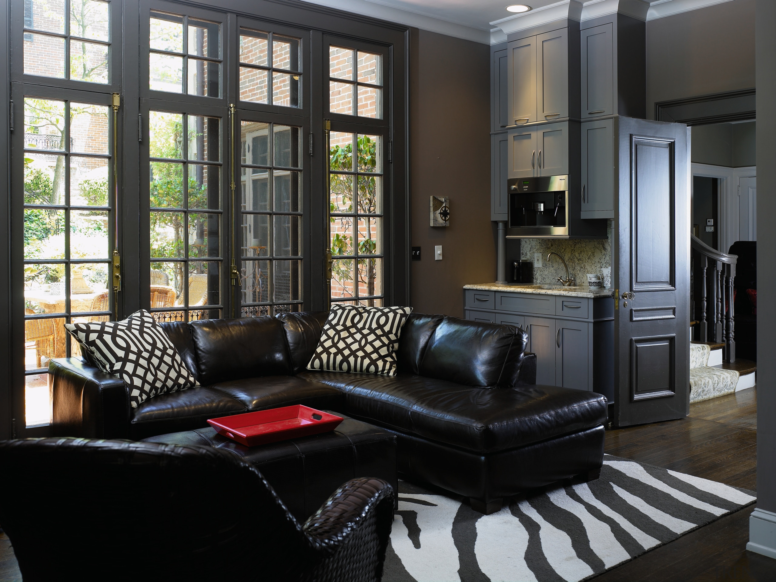 Three rooms were combined to create the kitchen. furniture, home, interior design, living room, room, window, black