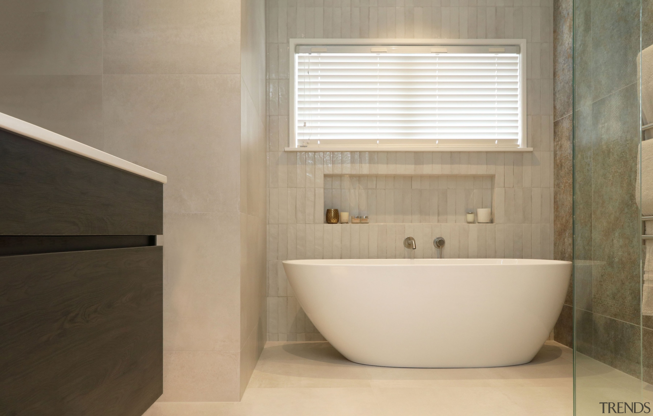 The main bathroom awash with subtle tile tones. 