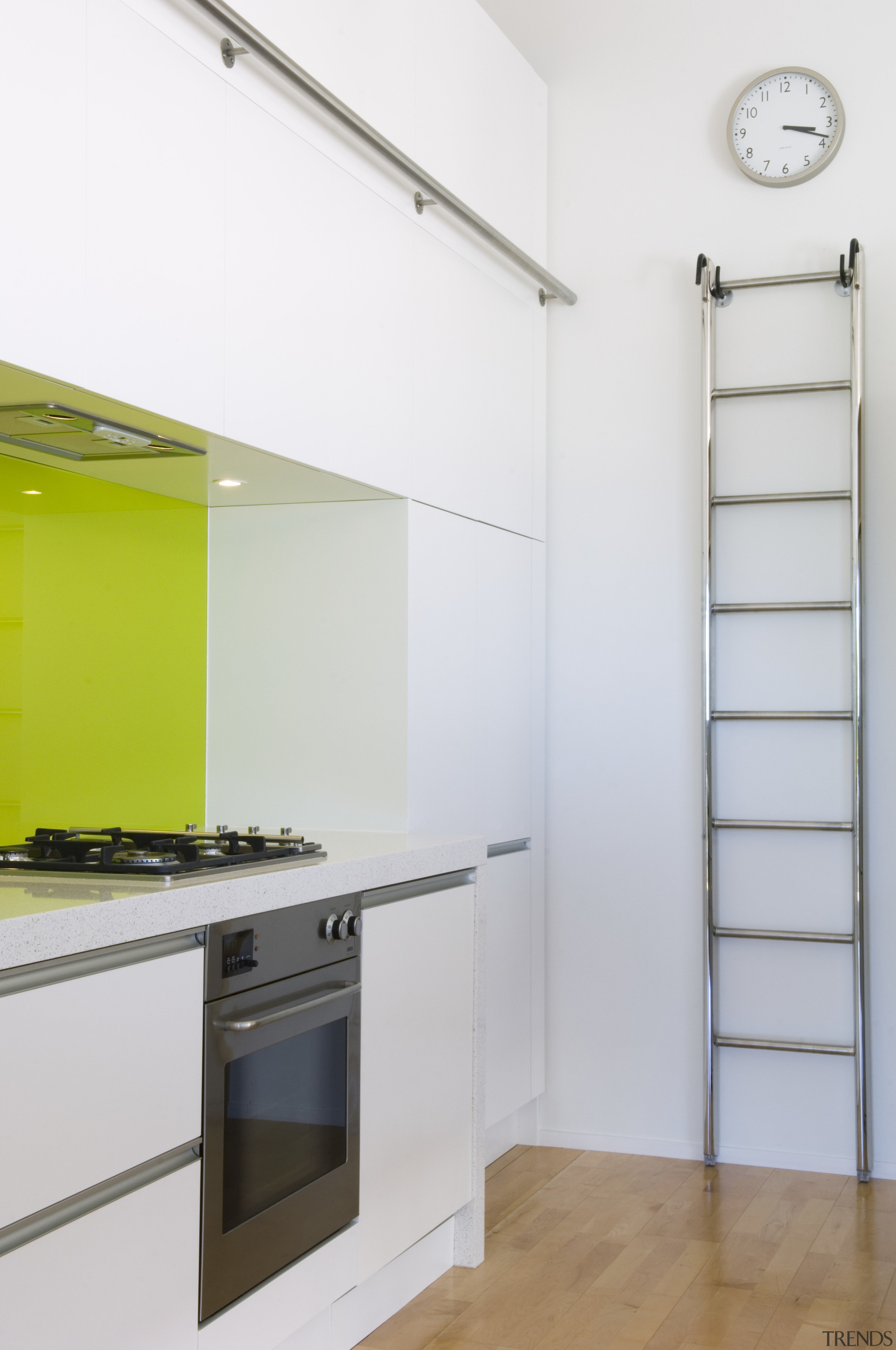 A view of the kitchen, wooden flooring, white interior design, product design, white