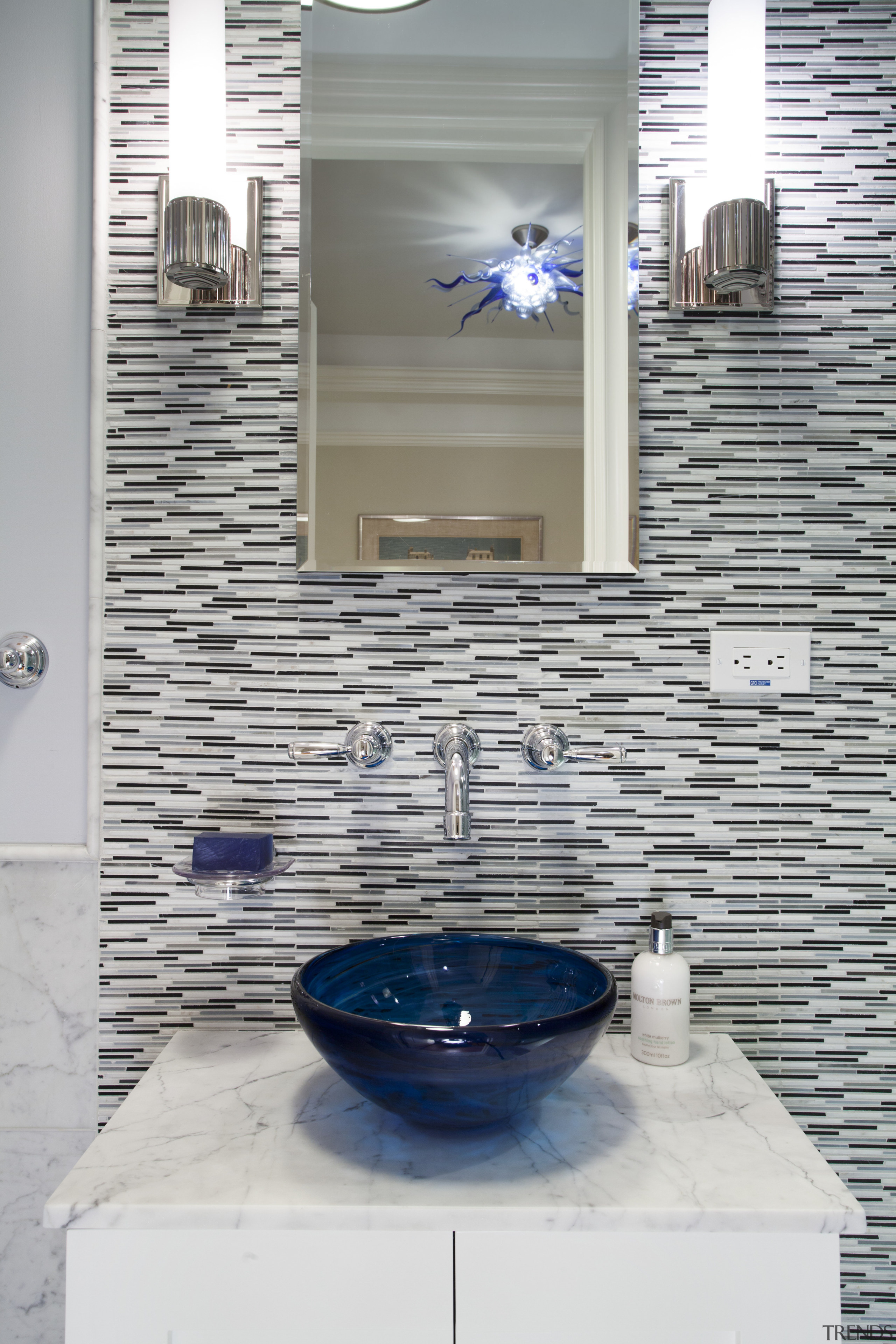 This bathroom has Art Deco tapware, a freestanding bathroom, floor, flooring, glass, interior design, room, sink, tile, wall, gray