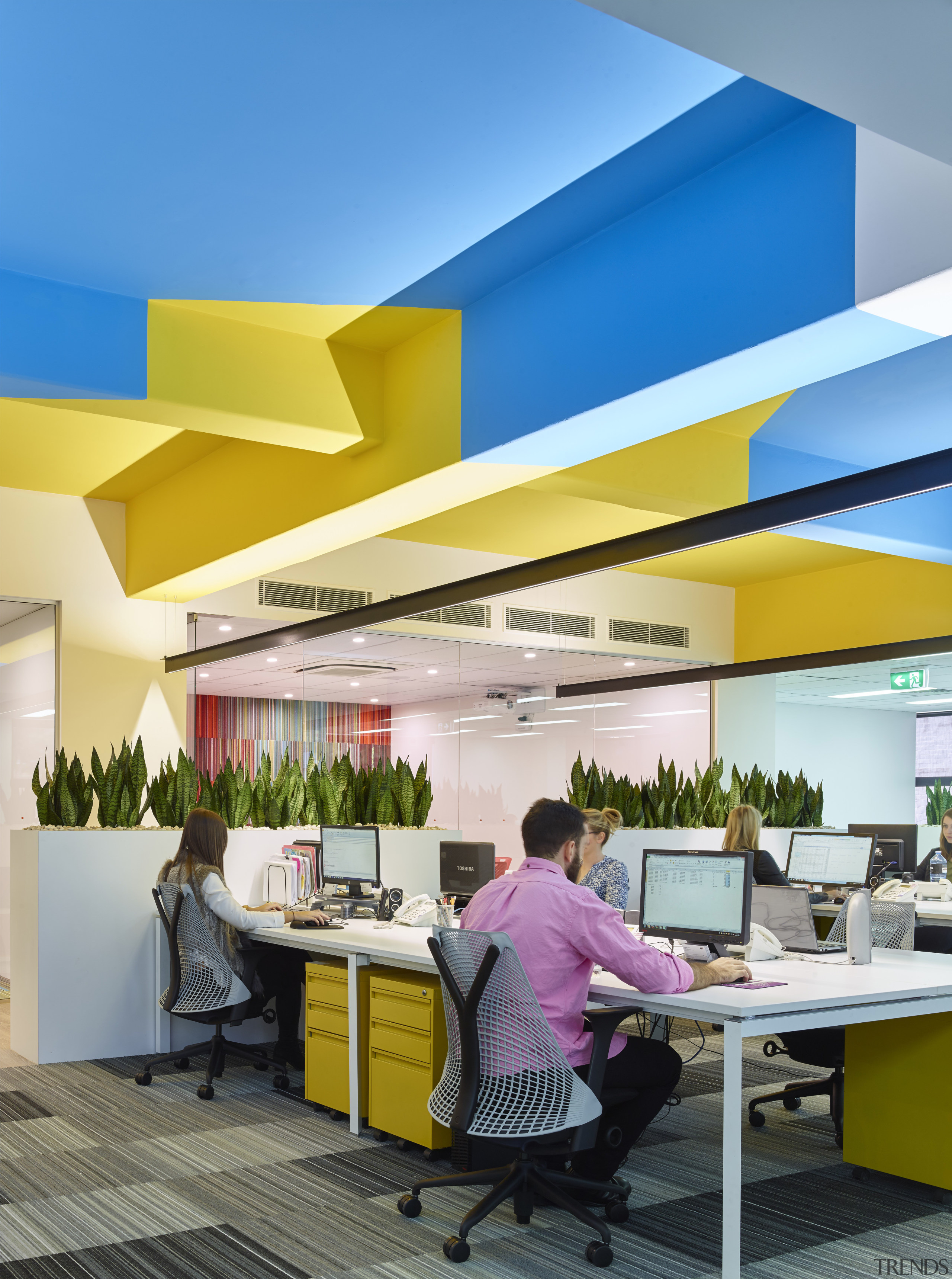 The ceiling pattern in this renovated office intersects architecture, ceiling, interior design, office, real estate, yellow