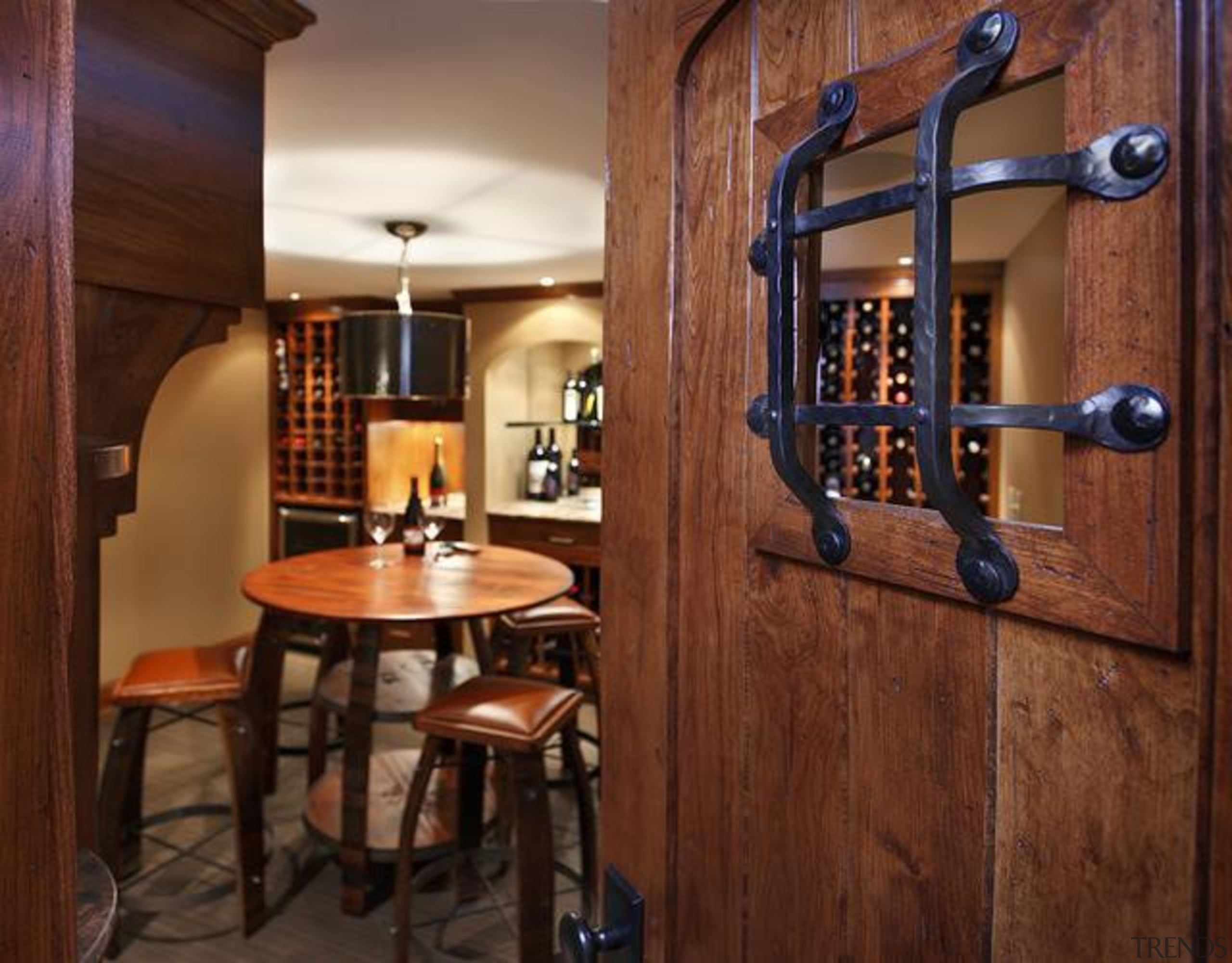 Because of its expansive and wide-open layout, a cabinetry, countertop, interior design, wine cellar, brown, red