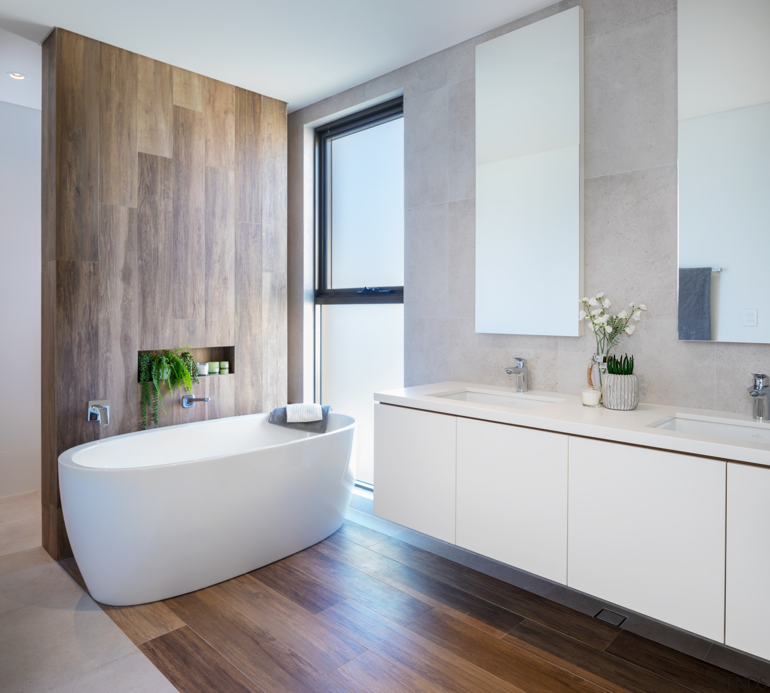 This bathroom continues the use of natural materials architecture, bathroom, bathroom accessory, bathroom cabinet, bathtub, beige, building, cabinetry, ceiling, ceramic, floor, flooring, furniture, hardwood, home, house, interior design, material property, plumbing fixture, property, real estate, room, sink, tap, tile, wall, wood flooring, gray