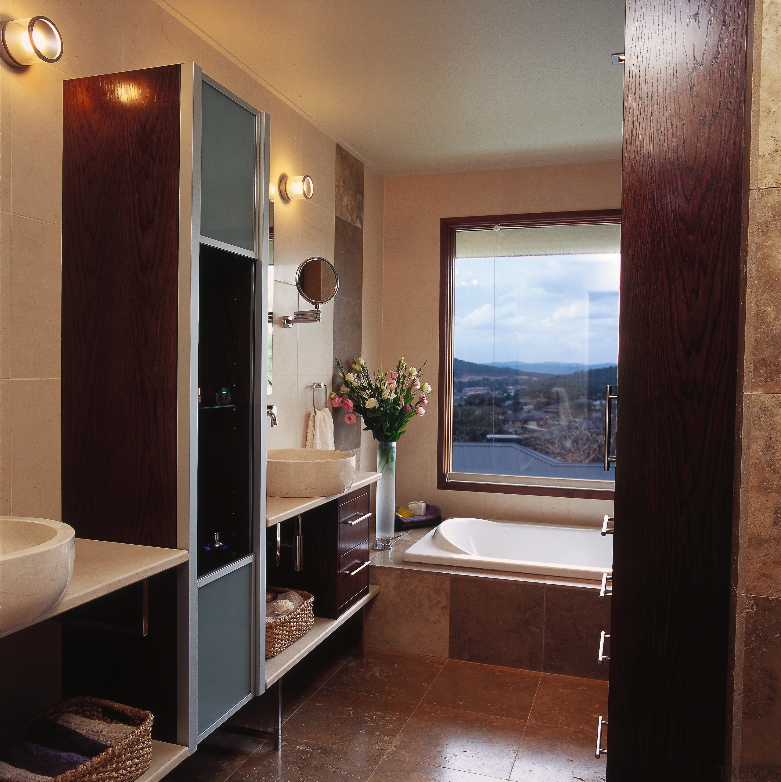 The view of a bathroom from the doorway bathroom, cabinetry, interior design, room, black, brown