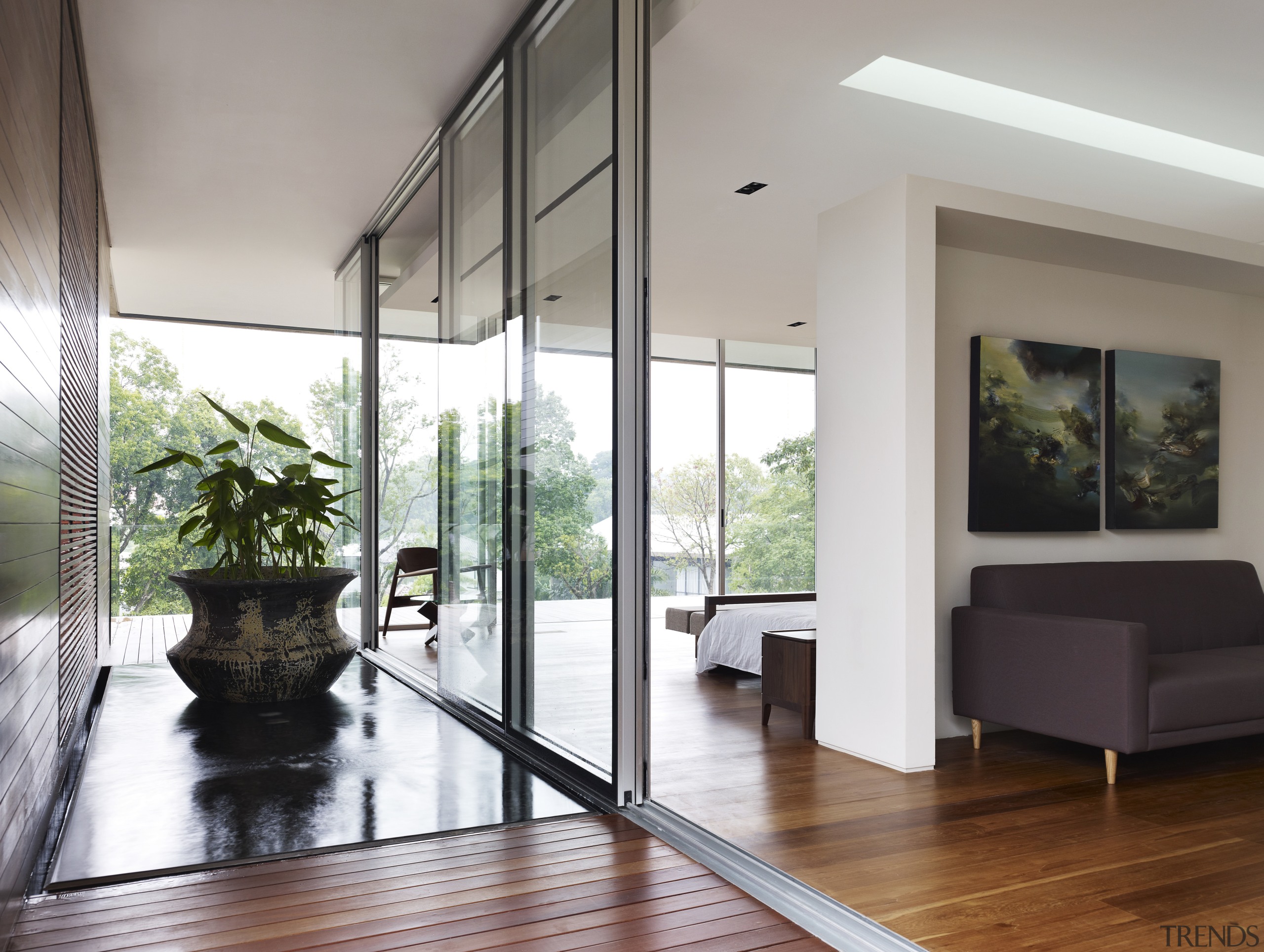 Floor-to-ceiling glass ensures the bedrooms in this new architecture, door, floor, flooring, hardwood, home, house, interior design, laminate flooring, living room, property, real estate, window, wood flooring, gray