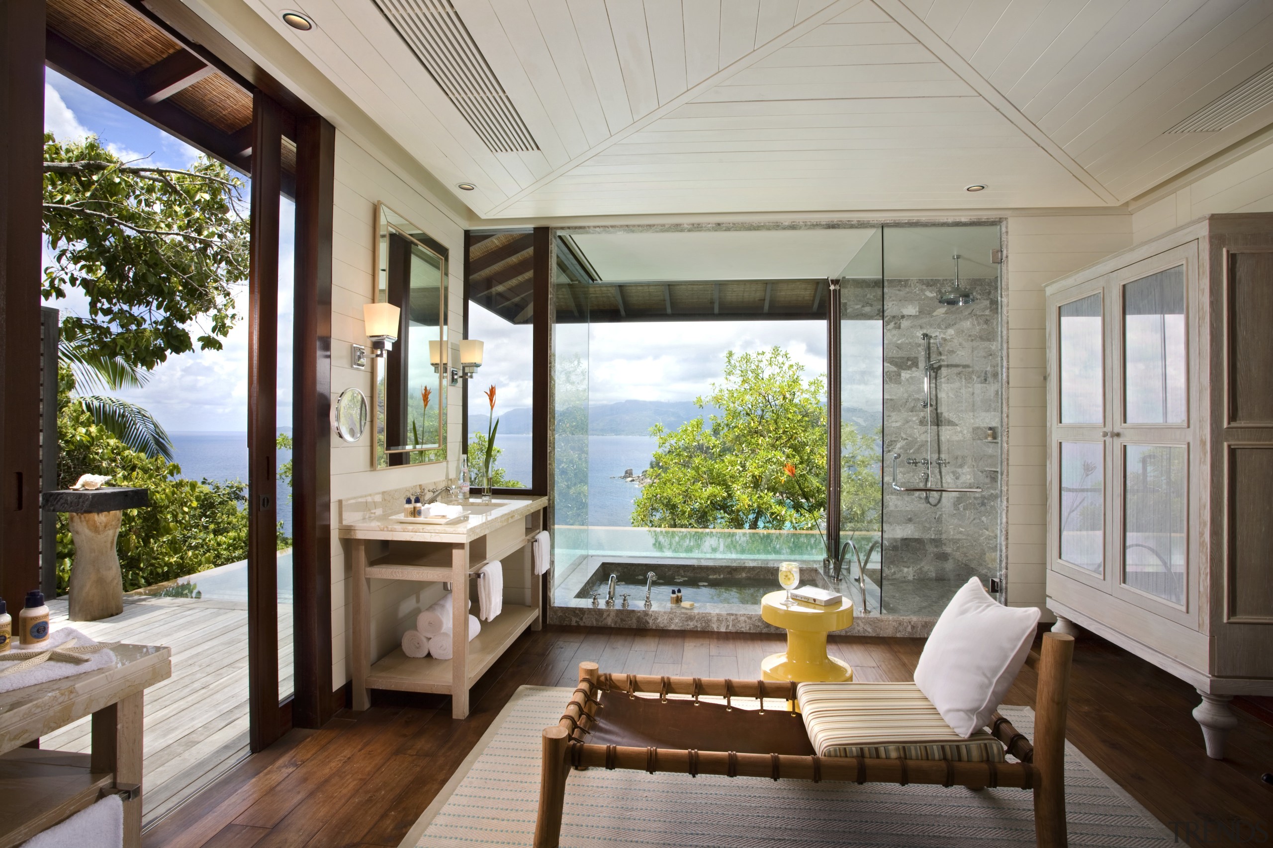 View of Four Seasons Seychelles high-end resort - balcony, daylighting, estate, home, house, interior design, living room, porch, real estate, window, gray, brown