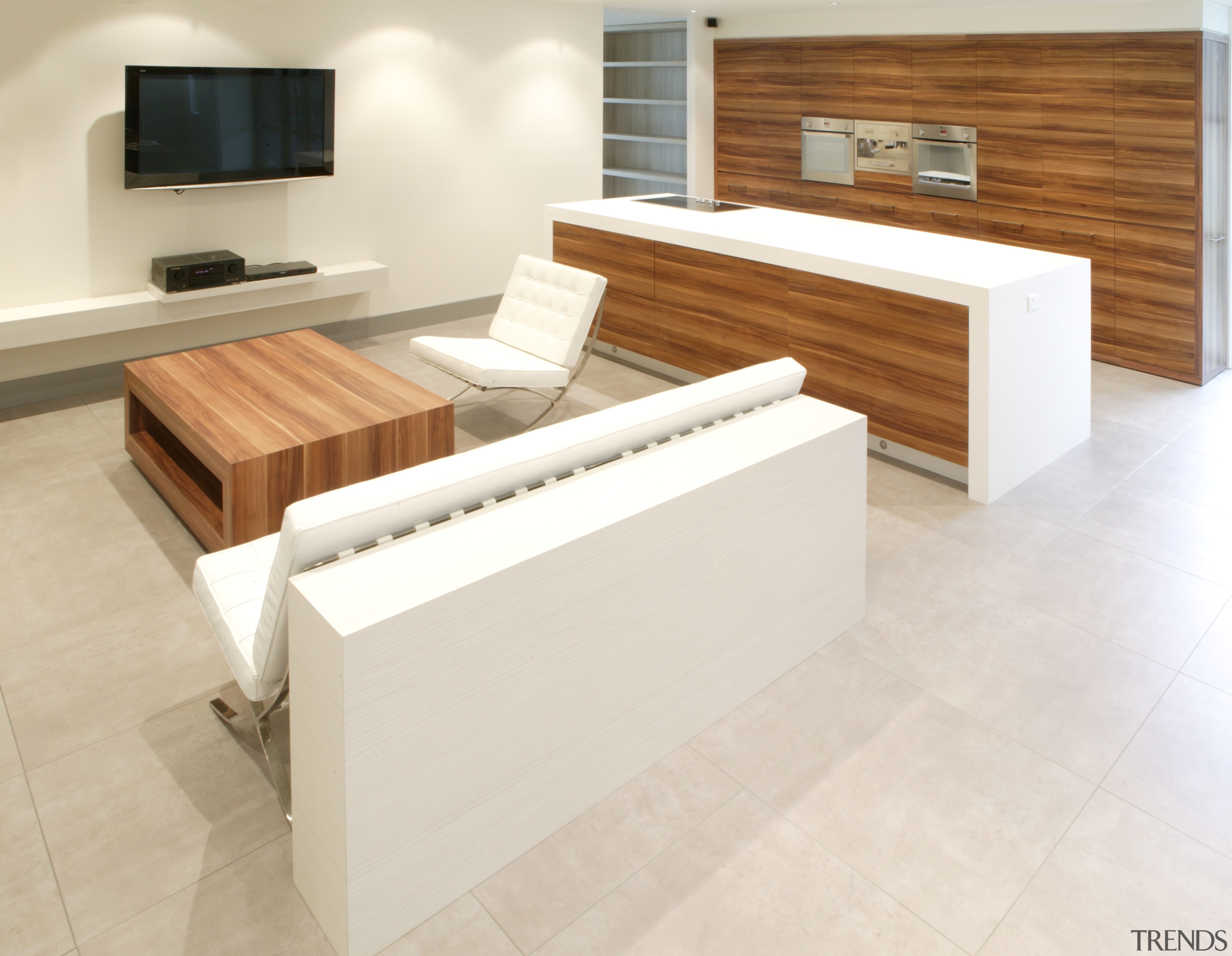 View of the living area which features a coffee table, floor, flooring, furniture, hardwood, interior design, laminate flooring, product design, table, tile, wood, wood flooring, white