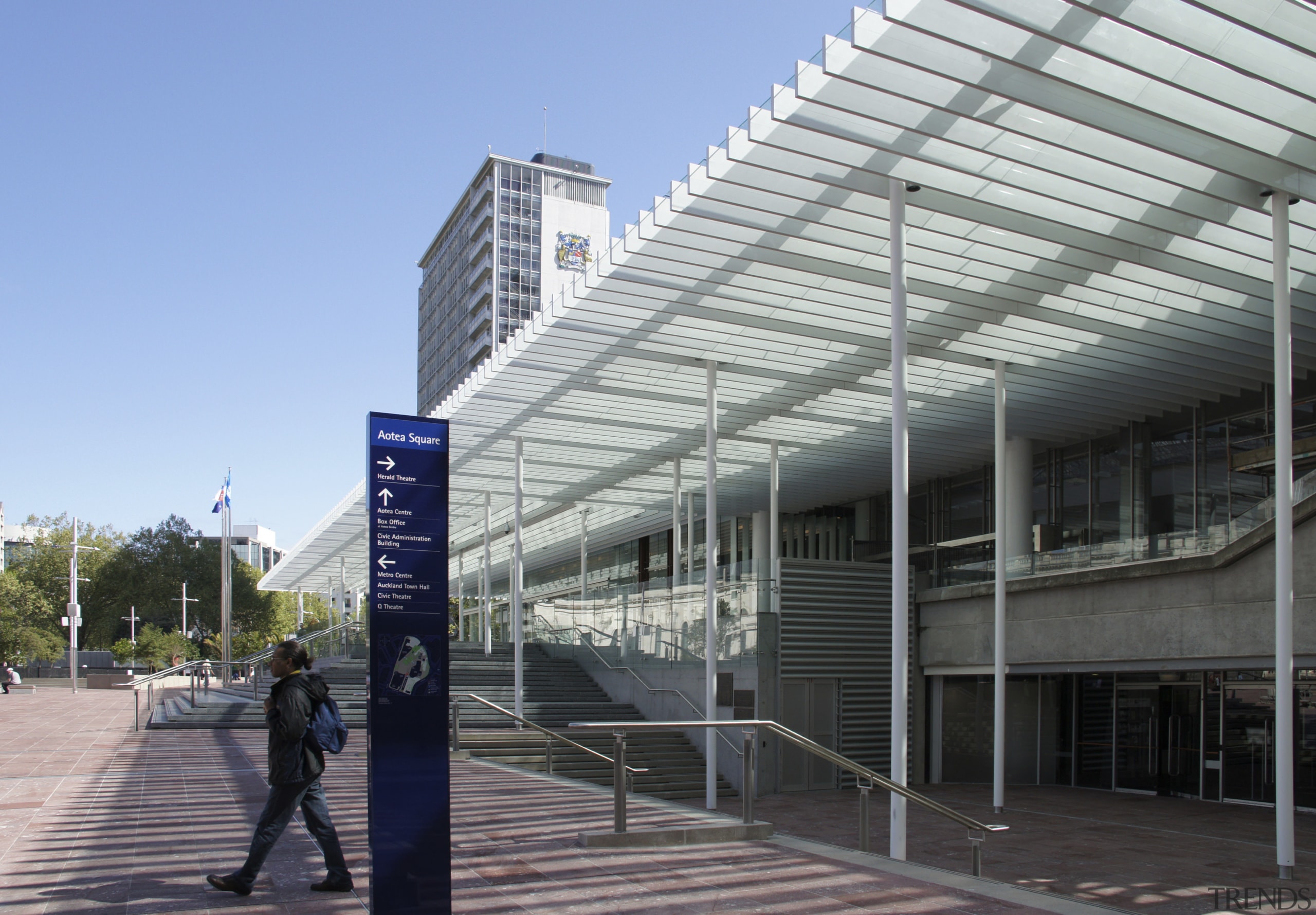 View of Aotea Square which features paving, planters, architecture, building, commercial building, condominium, convention center, corporate headquarters, daylighting, daytime, facade, headquarters, metropolis, metropolitan area, mixed use, neighbourhood, residential area, structure, urban design, walkway, gray