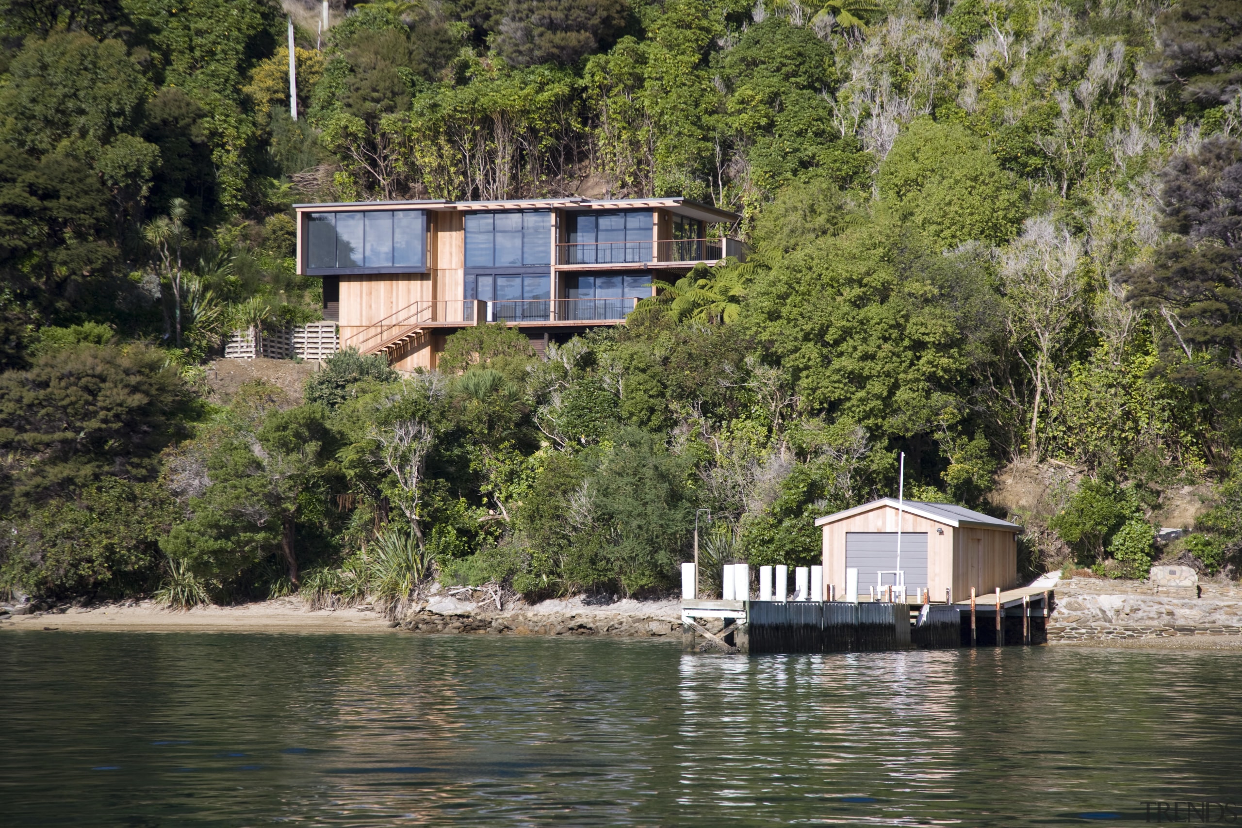 Exterior view of house and original boat shed cottage, home, house, lake, plant, property, real estate, reflection, reservoir, river, tree, water, waterway, brown