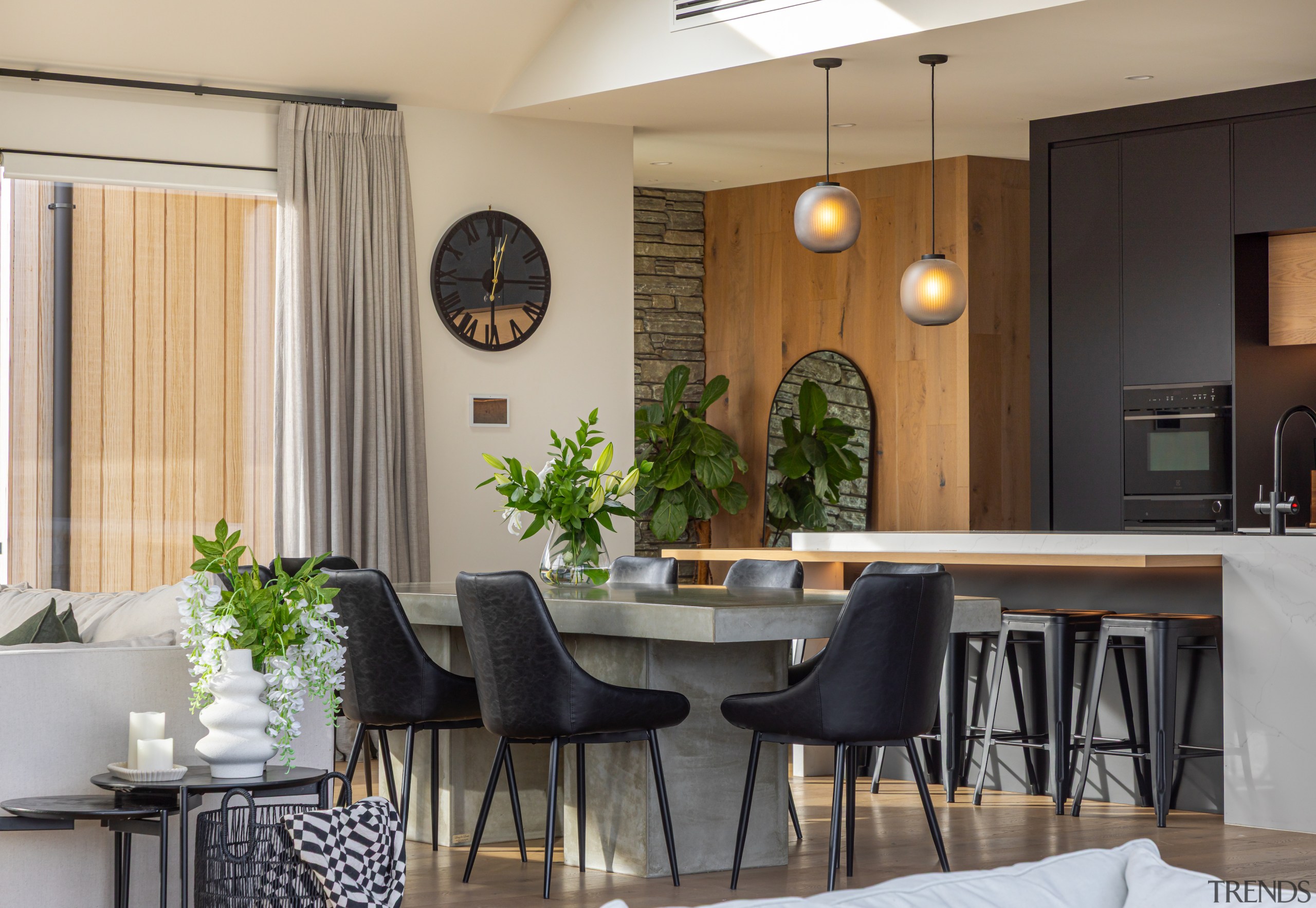 Dining area with rectangular concrete dining table. 
