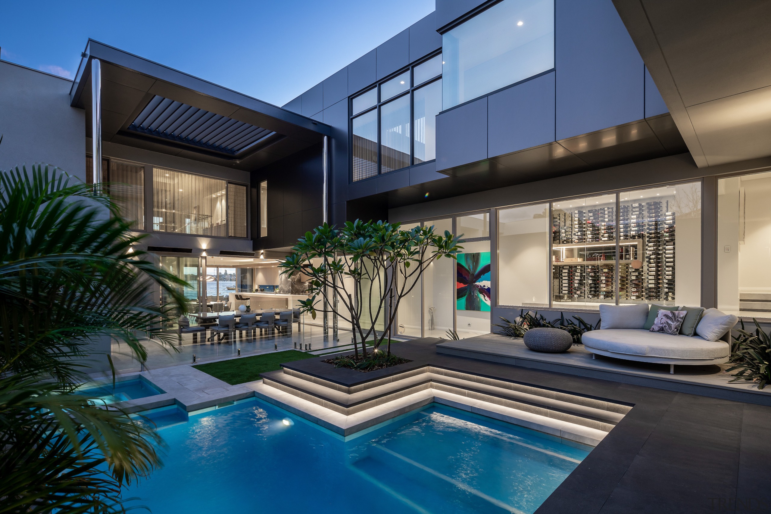 Central pool with circulation behind and wine cellar 