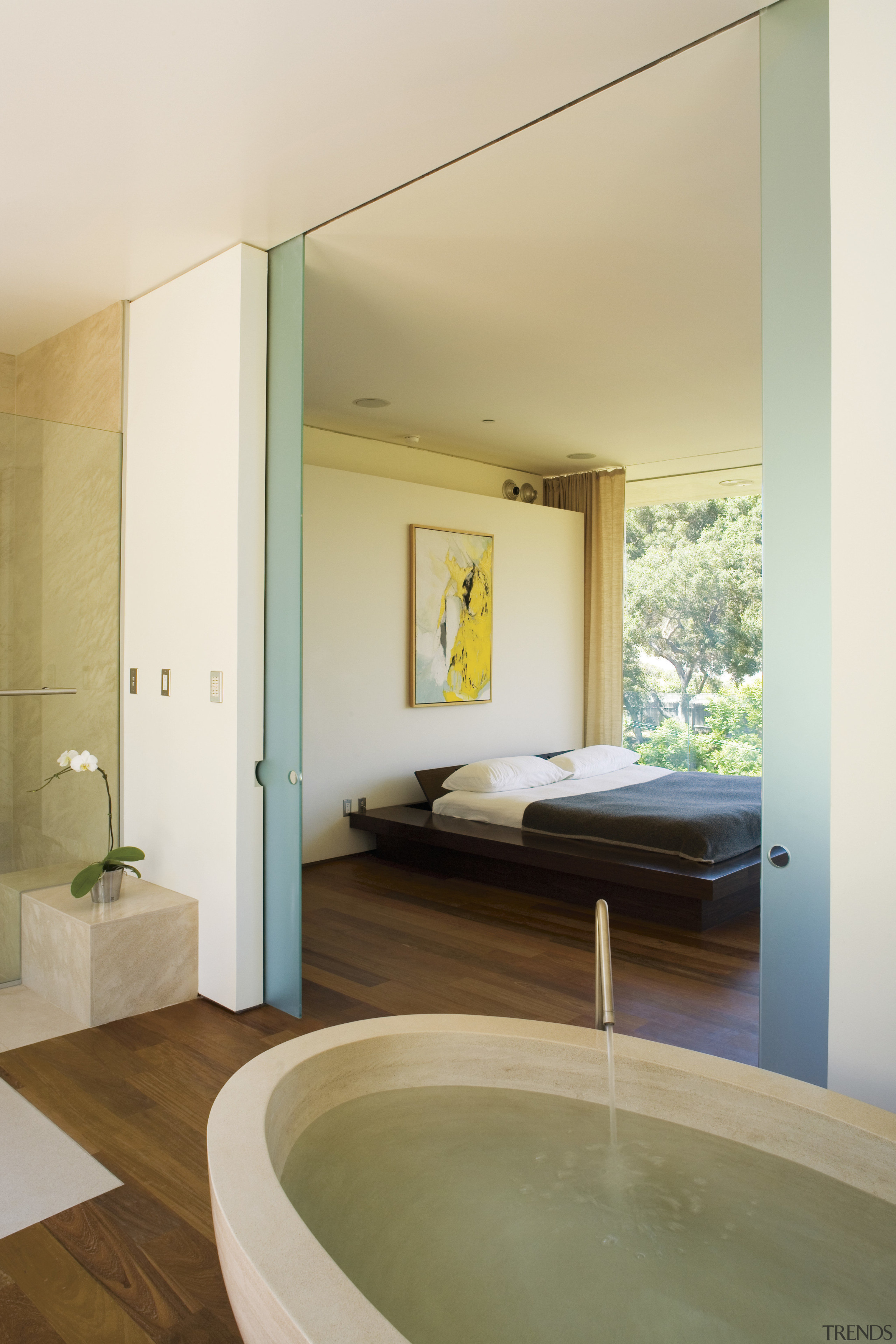 A view of the bathroom featuring oval limestone architecture, bathroom, ceiling, daylighting, door, estate, floor, flooring, home, house, interior design, real estate, room, suite, wall, window, wood, wood flooring, white, brown