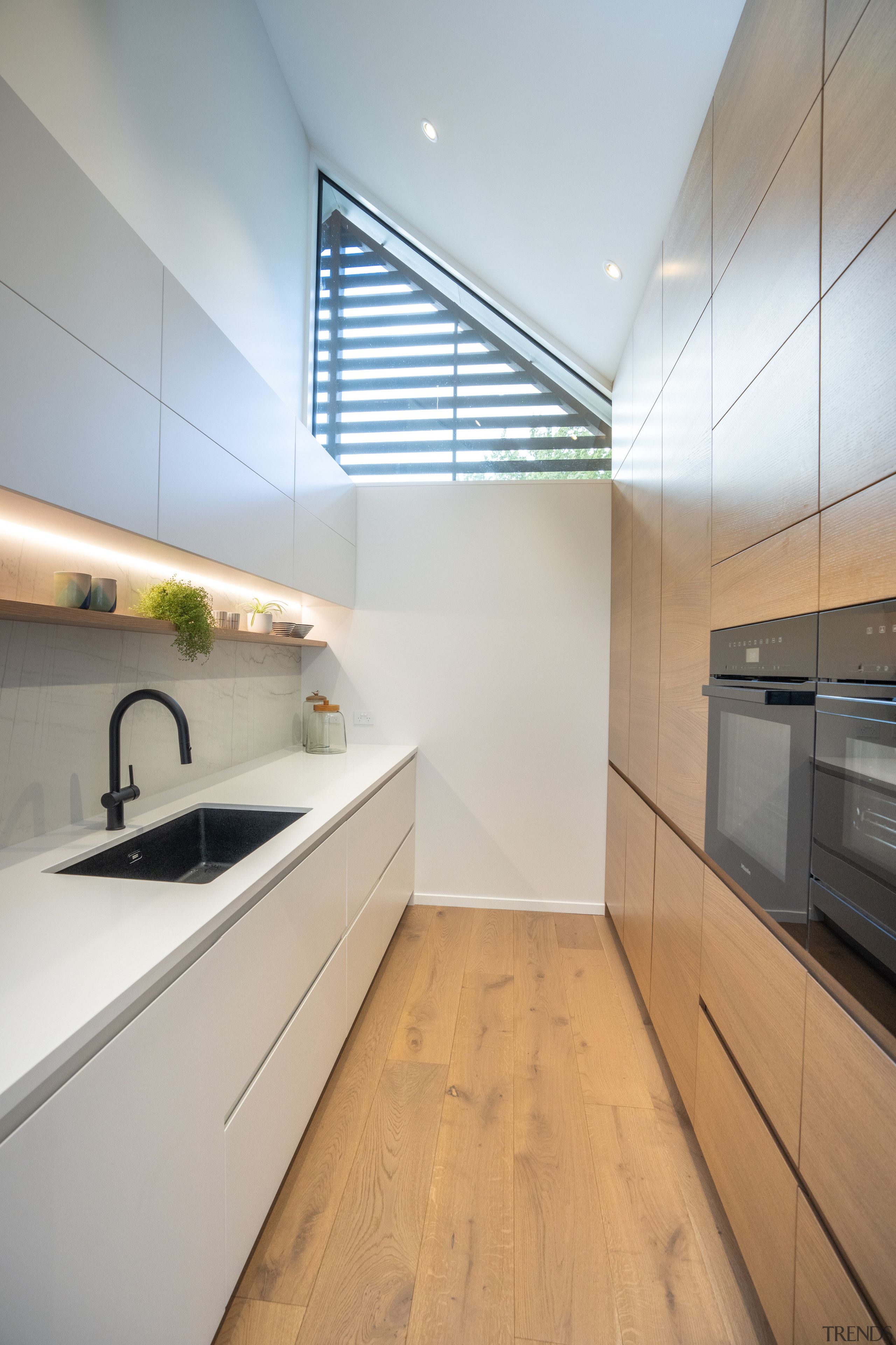 Walk in pantry with ample wall cabinetry on 