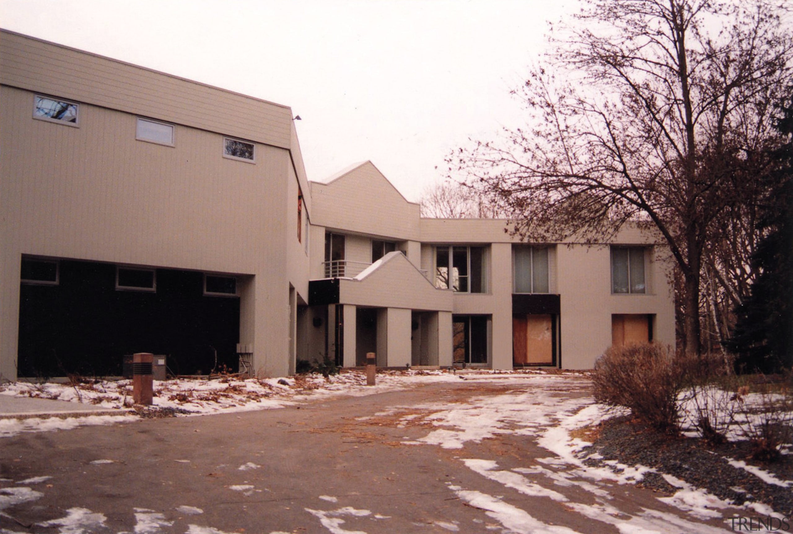 The original house was large, dated and full architecture, building, estate, facade, home, house, neighbourhood, property, real estate, residential area, suburb, window, winter, white, red