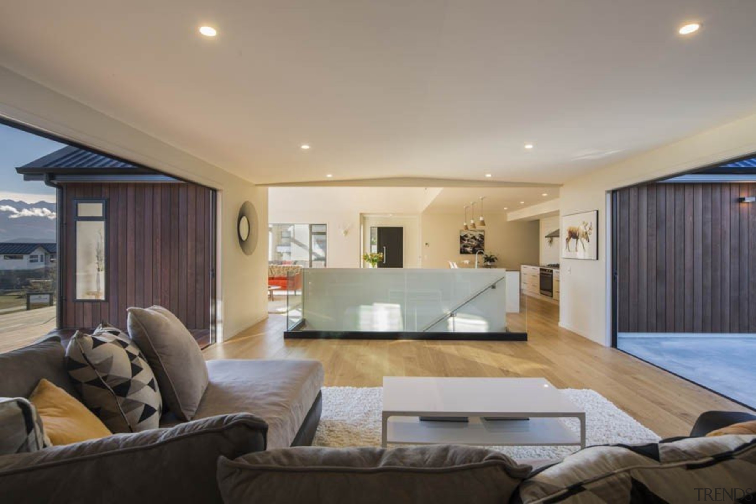 Timber floors work beautifully in this living room architecture, ceiling, estate, floor, home, house, interior design, living room, property, real estate, room, wall, gray