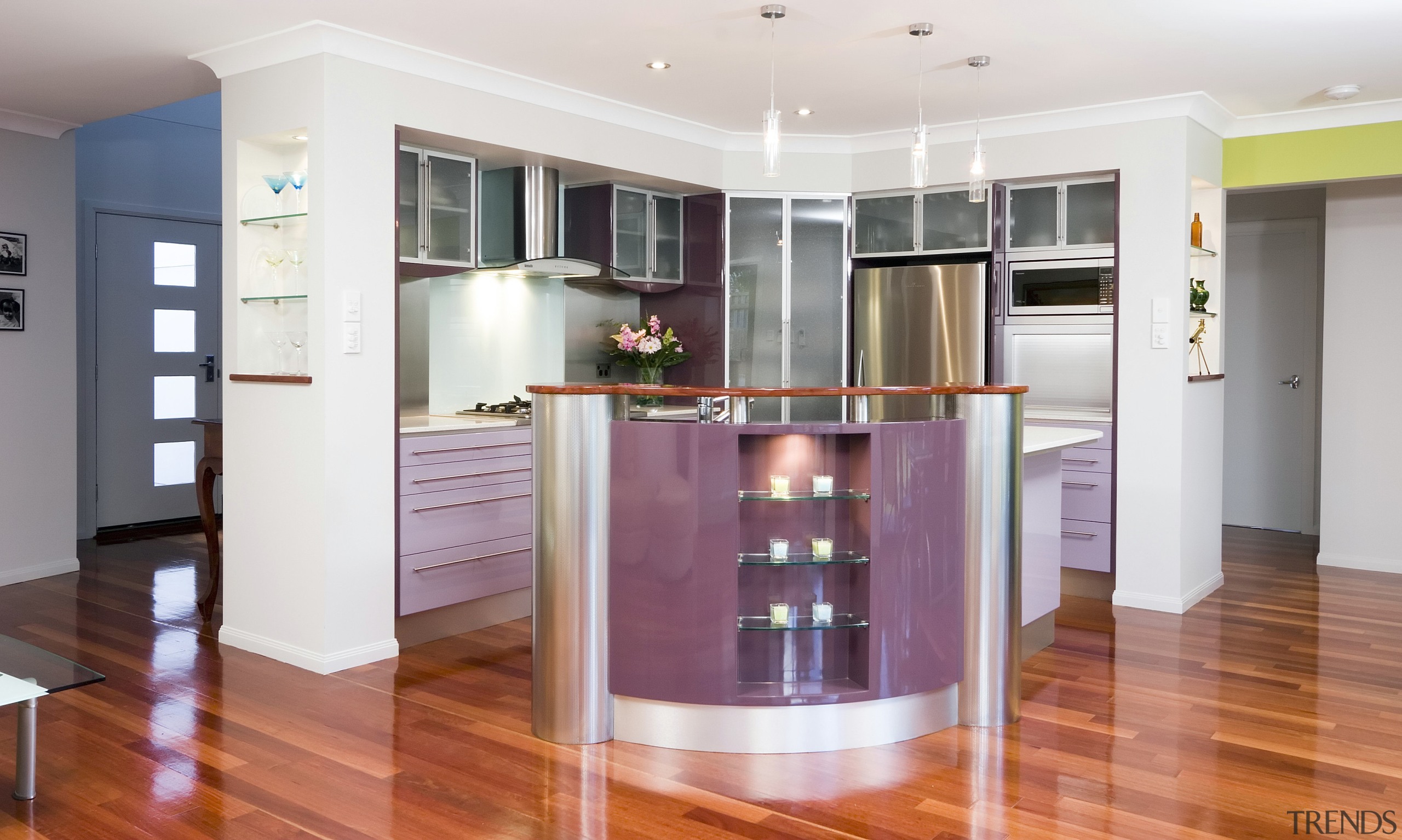 A view of a kitchen designed by KBDI. cabinetry, floor, flooring, hardwood, interior design, kitchen, property, real estate, room, wood flooring, white, red