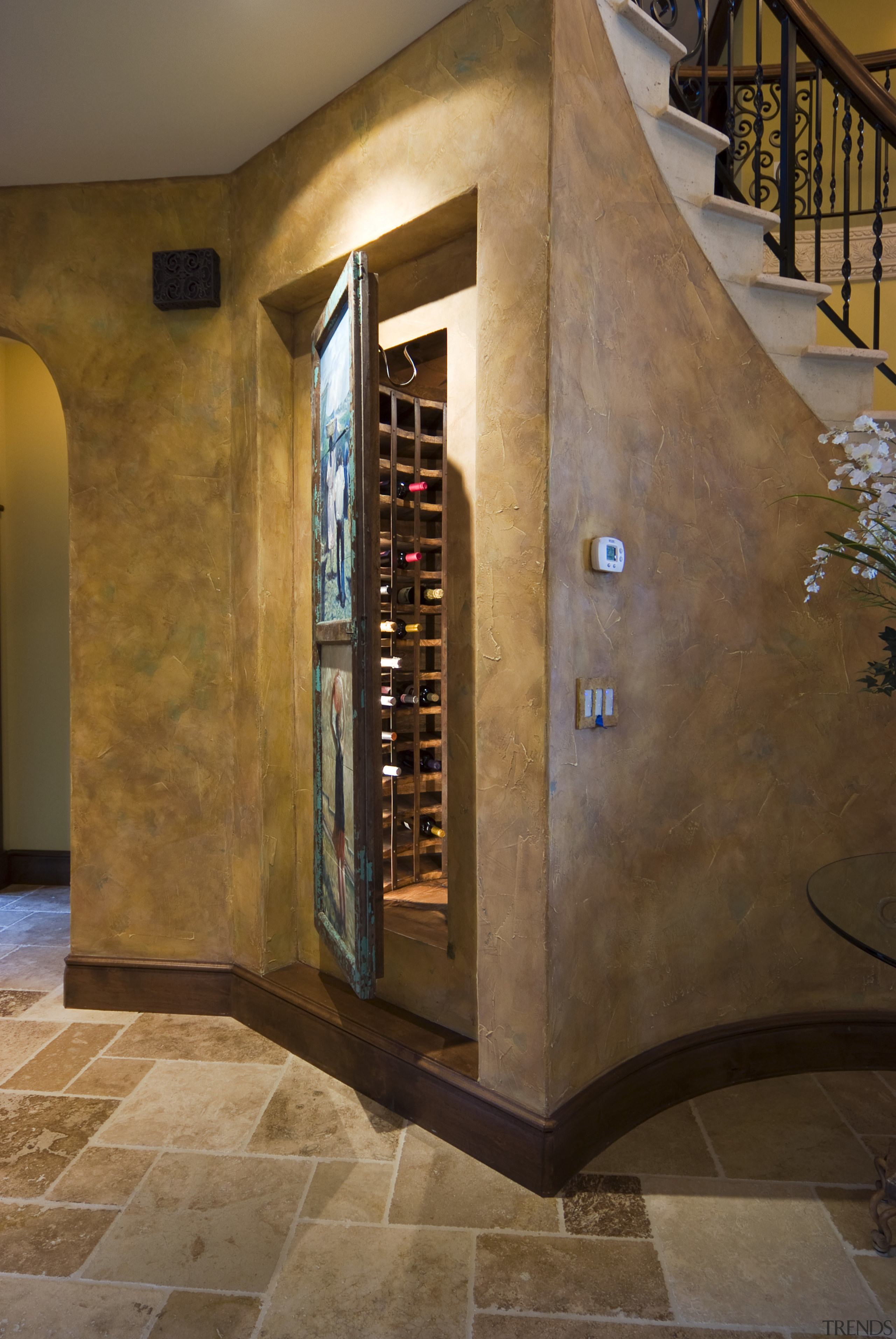 Image of the interior designed by Pacific Crest. floor, flooring, interior design, stairs, wall, wine cellar, brown