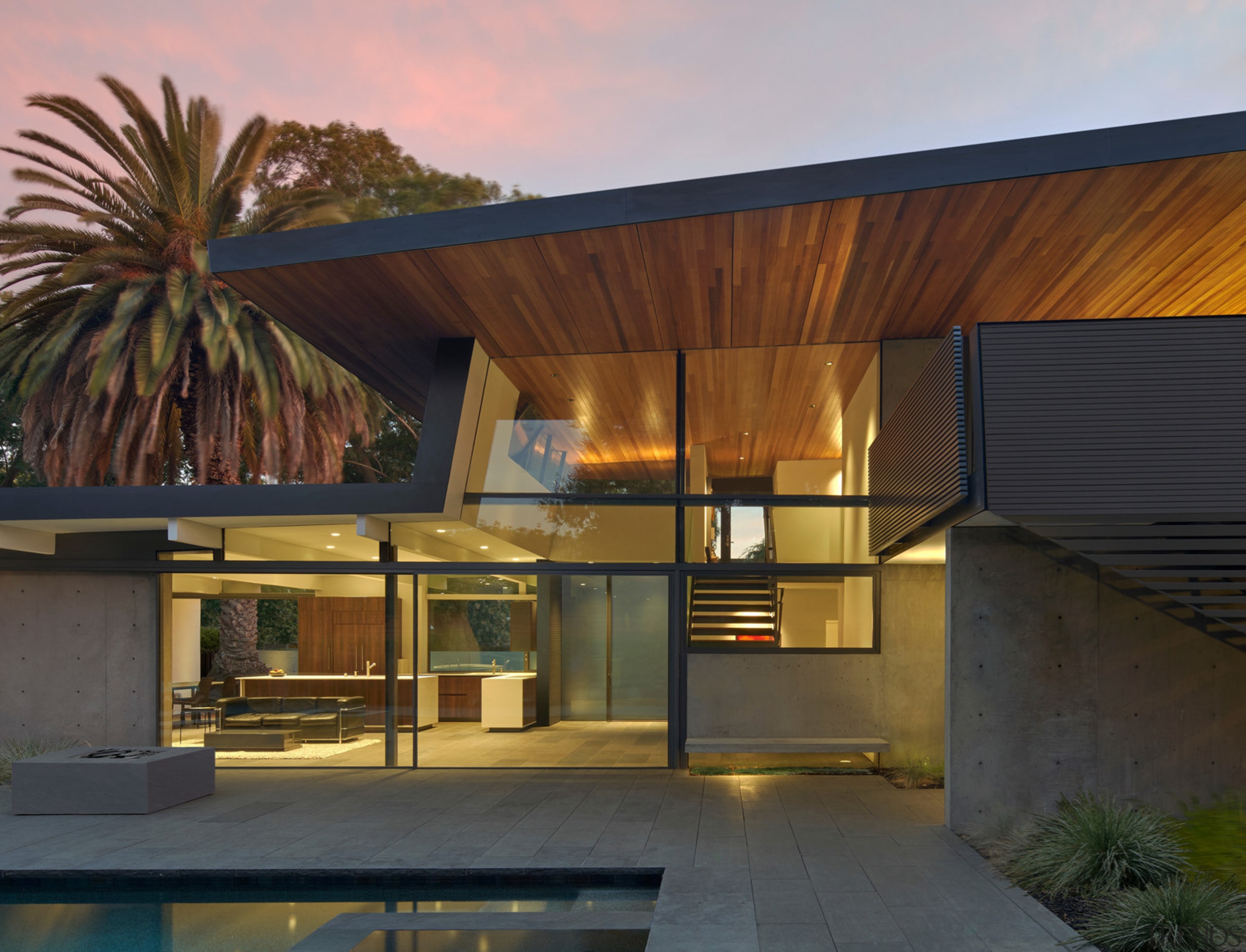 Dusk and the home's lighting accentuates features such 