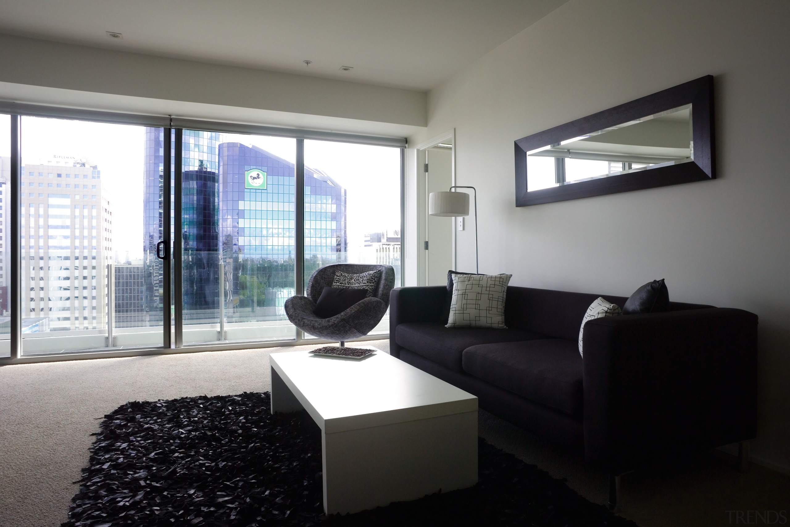 A view of the Precinct Apartments constructed by architecture, daylighting, home, house, interior design, living room, property, real estate, room, window, gray, black