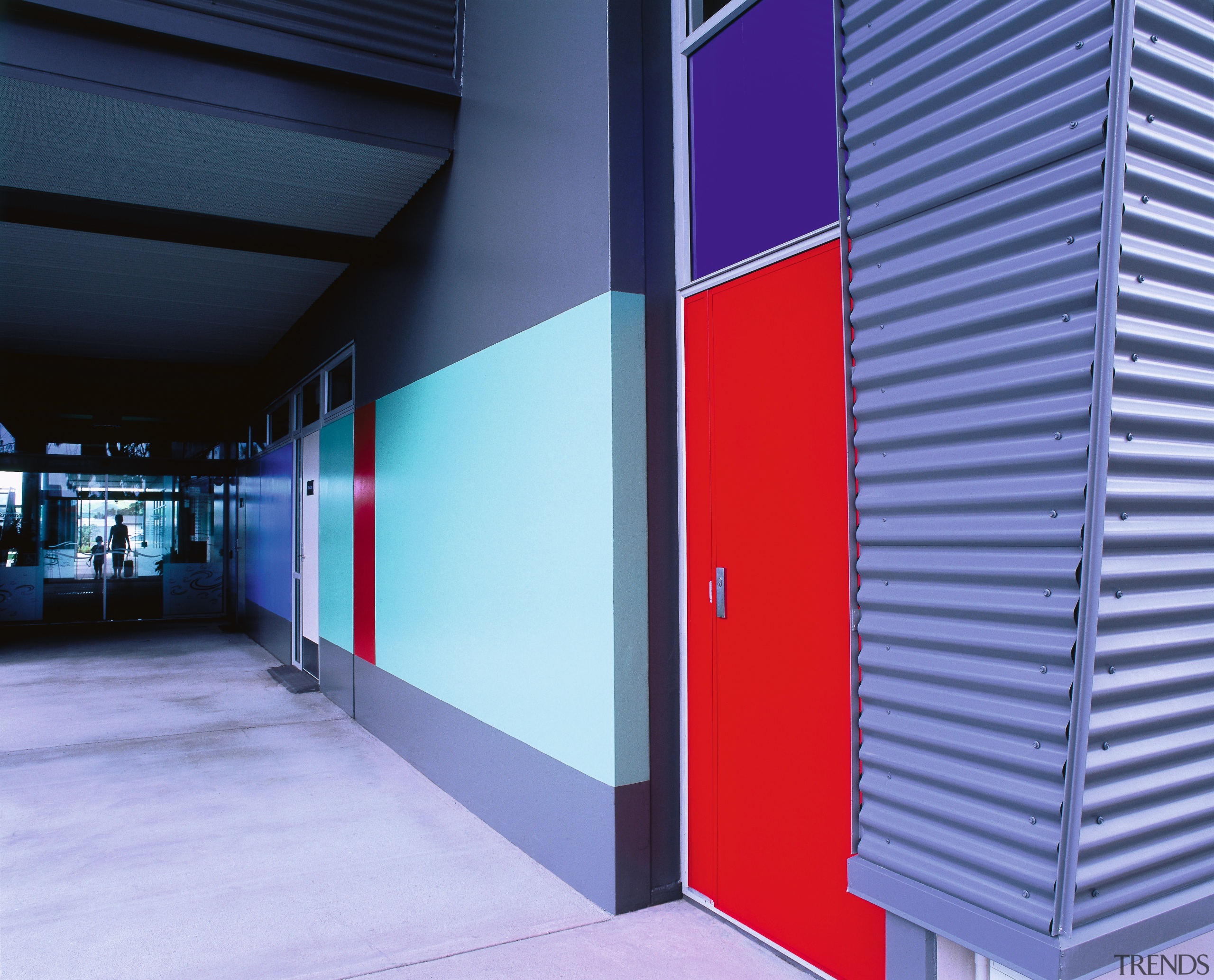Bright red, blues and neutral colours were used architecture, blue, door, line, structure, blue