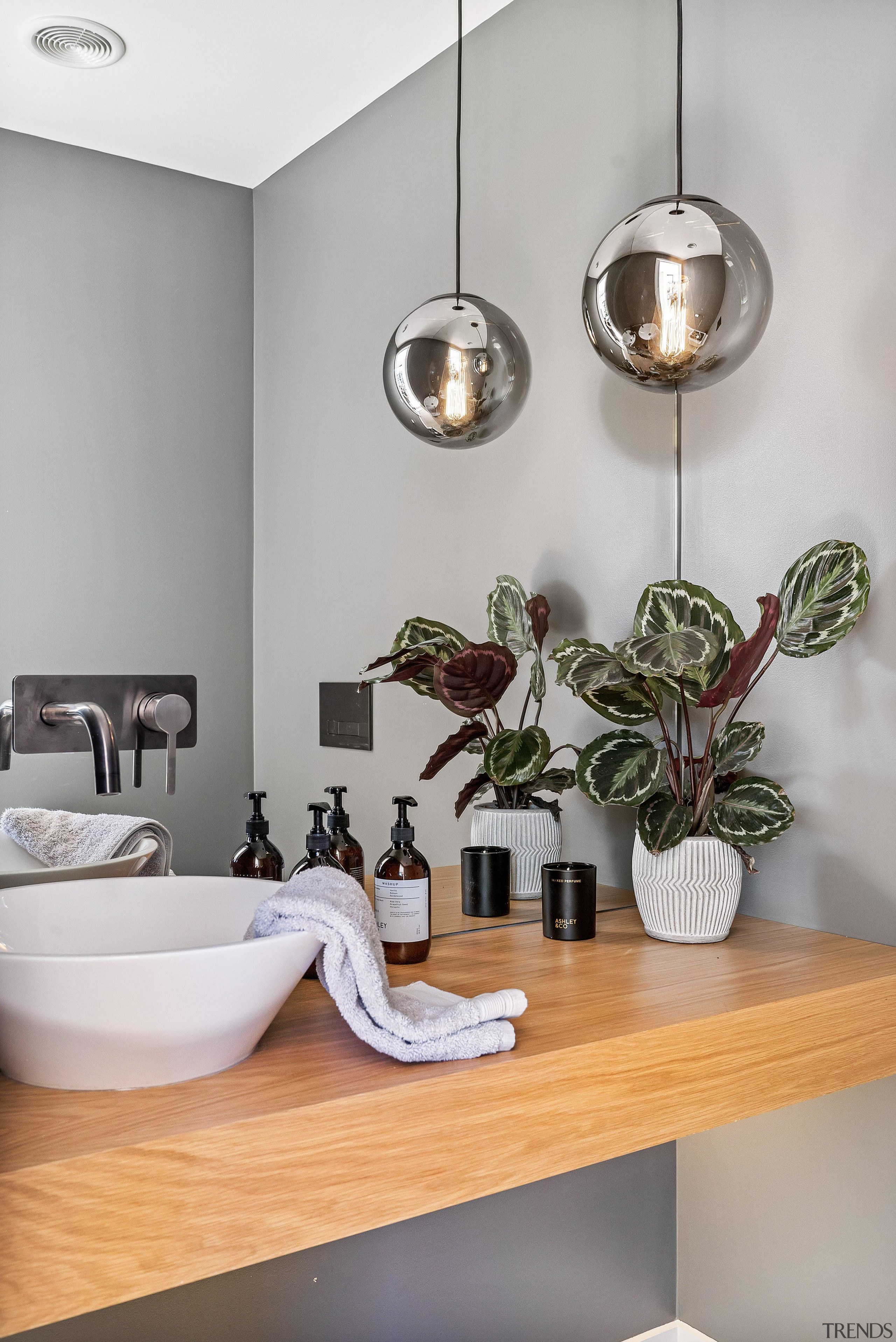 ​​​​​​​This contemporary powder room is finished in Resene bathroom, ceiling, ceramic, countertop, floor, flooring, furniture, home, interior design, material property, plumbing fixture, property, room, sink, tap, tile, wall, gray