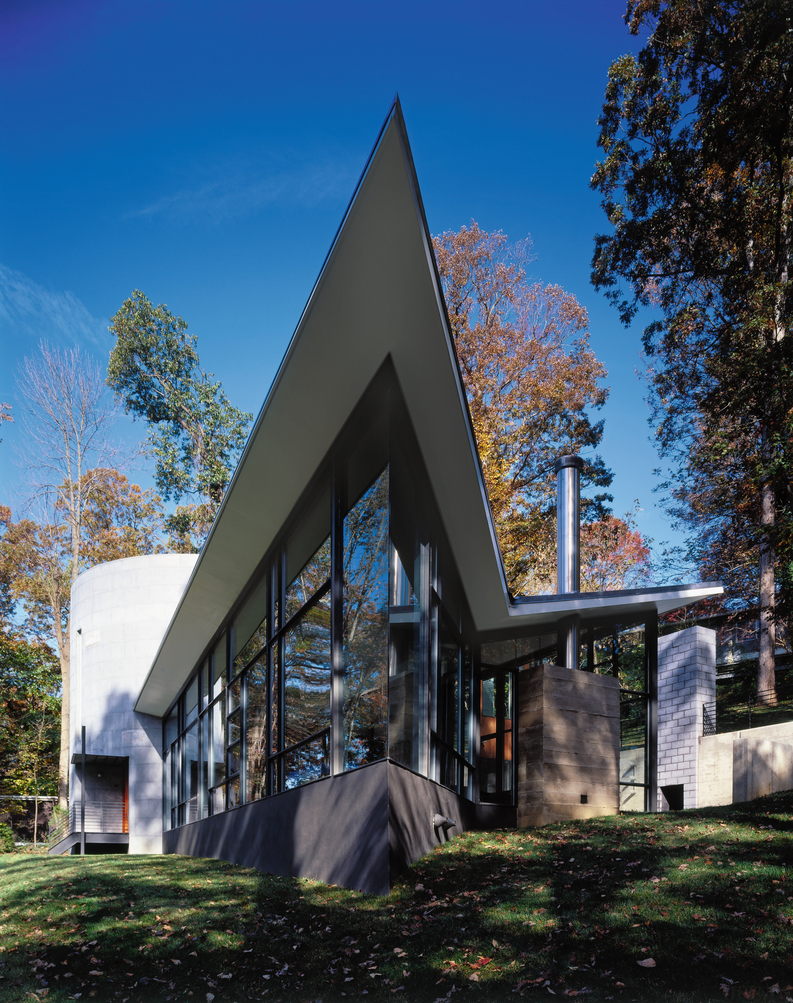 An exterior view of the house. - An architecture, building, cottage, facade, home, house, real estate, residential area, sky, tree, black