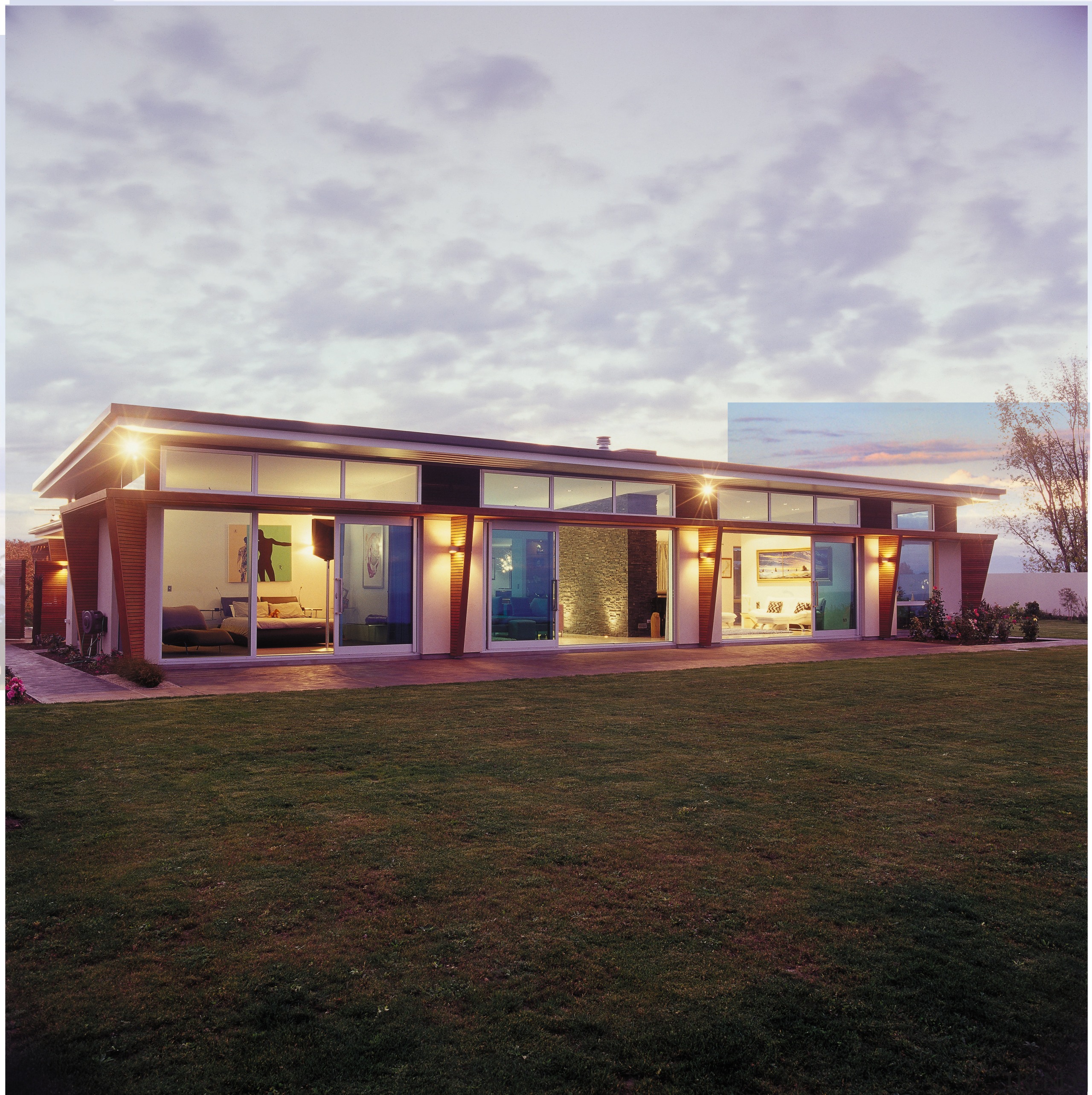 A view of a home by Novak &amp; facade, home, house, property, real estate, roof, sky, black, gray