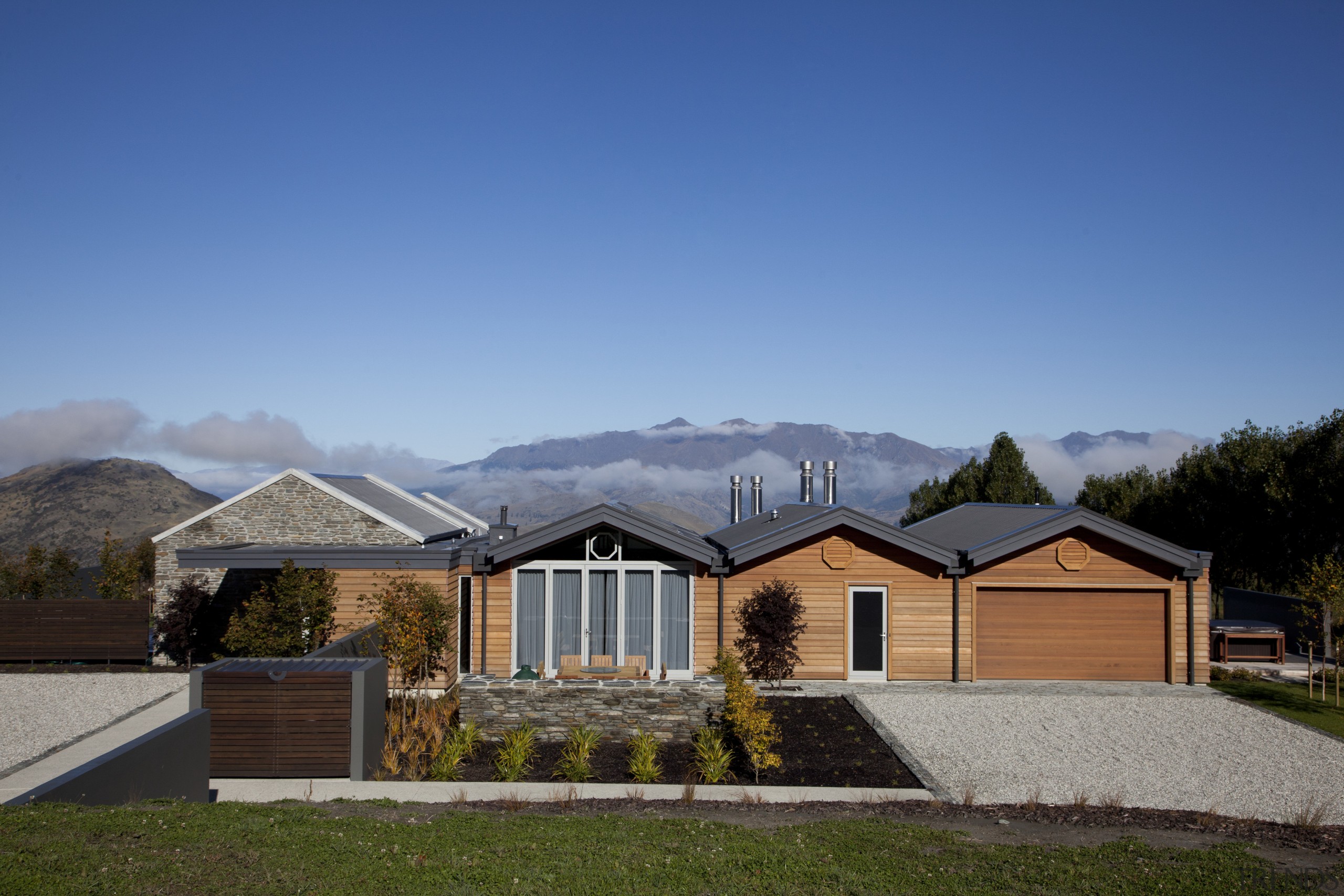 Exterior view of the entire home and entrance cloud, cottage, elevation, estate, facade, farmhouse, home, house, landscape, mountain, property, real estate, residential area, roof, siding, sky, suburb, teal