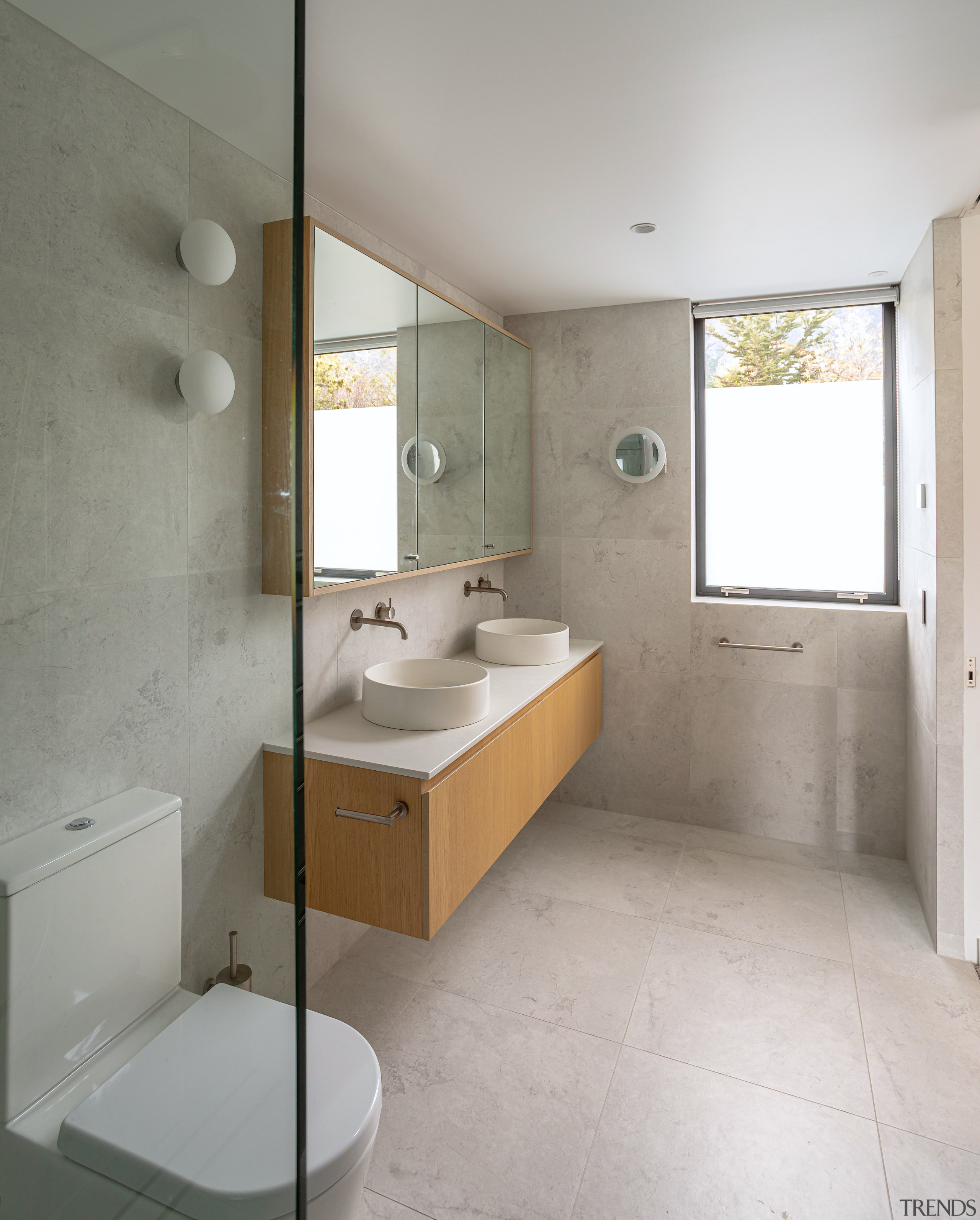 The custom floating vanity adds to the ensuite's 